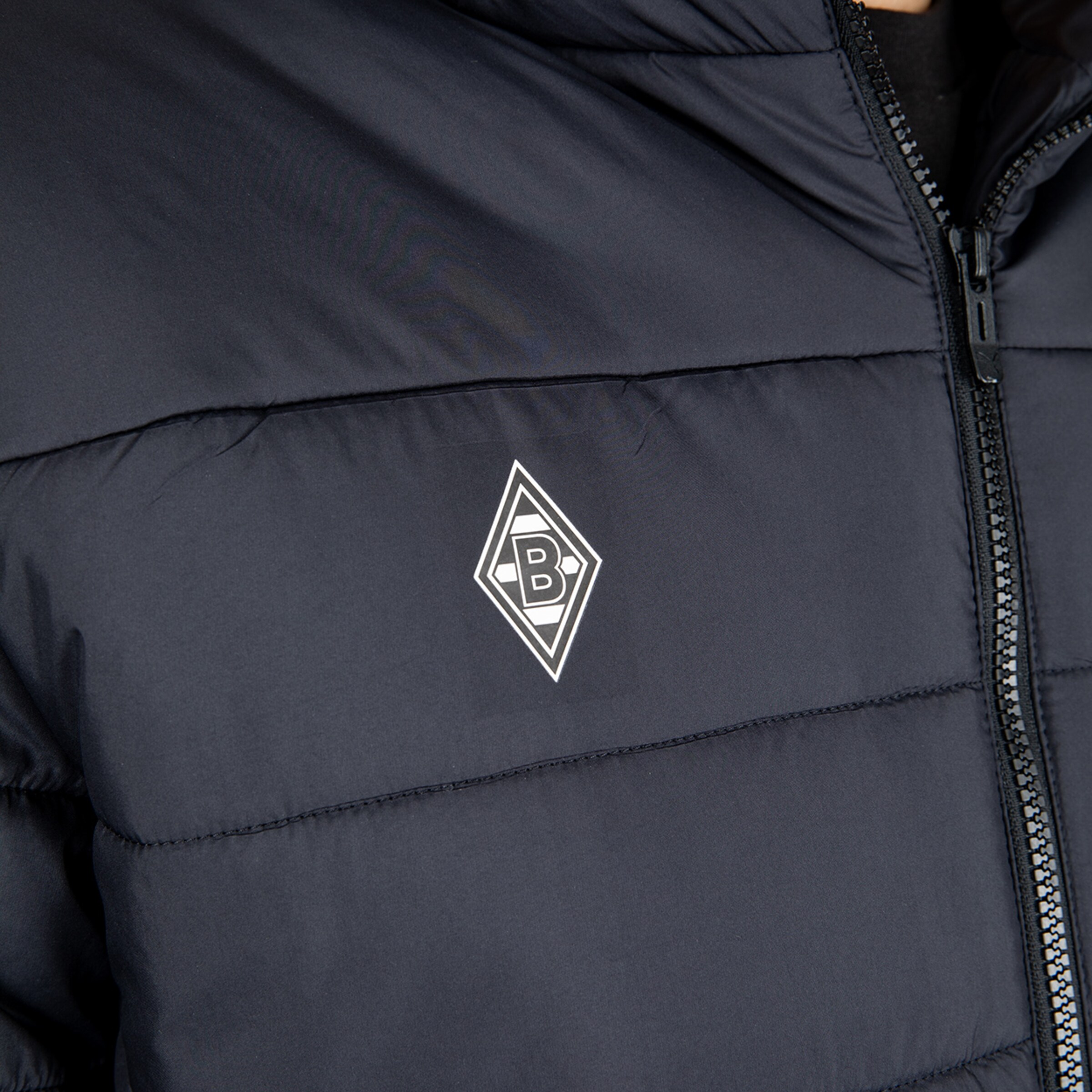 Dark blue padded jacket featuring the Borussia Mönchengladbach logo on the left chest.