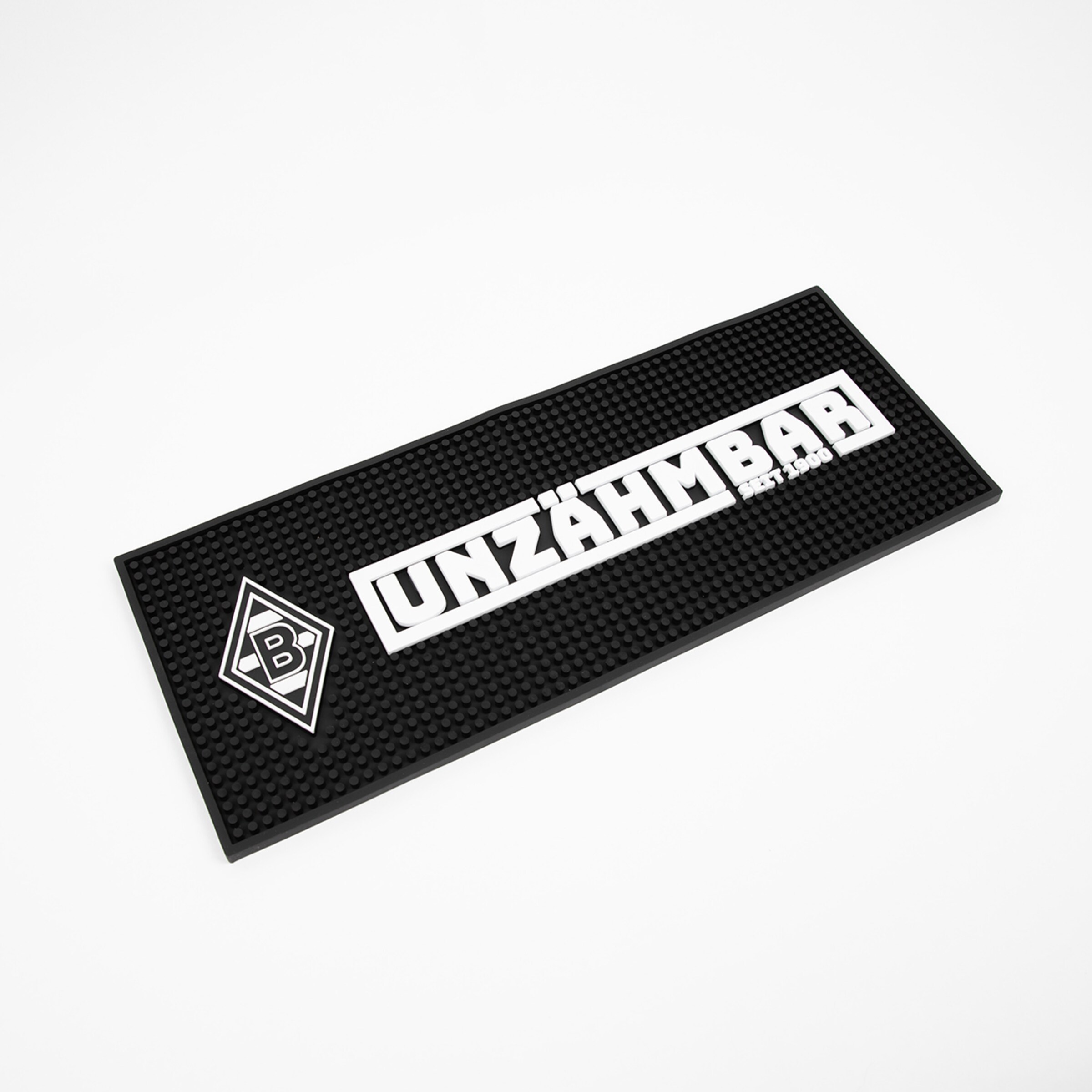 Schwarze Gummimatte mit dem Schriftzug UNZÄHMBAR und dem Borussia Mönchengladbach Logo.