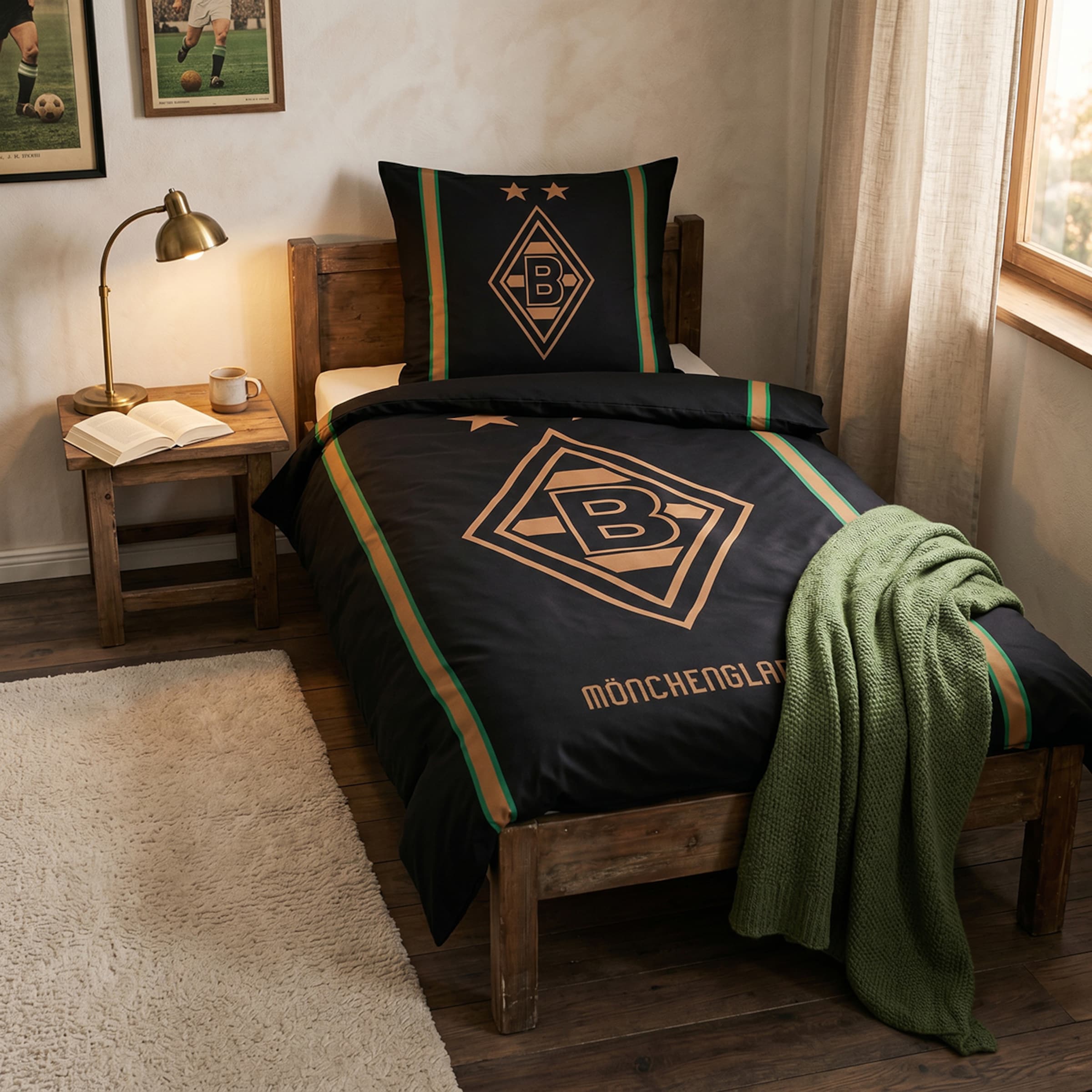Bedroom with Borussia Mönchengladbach bedding, green throw, nightstand with lamp and book, white rug, and football posters.