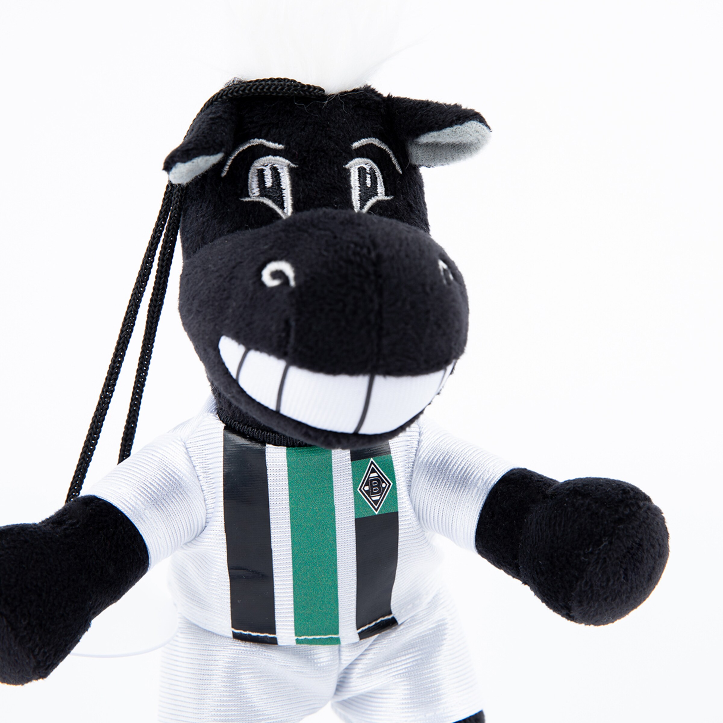 Jünter das Maskottchen von Borussia Mönchengladbach trägt ein Trikot mit Vereinslogo und lächelt.