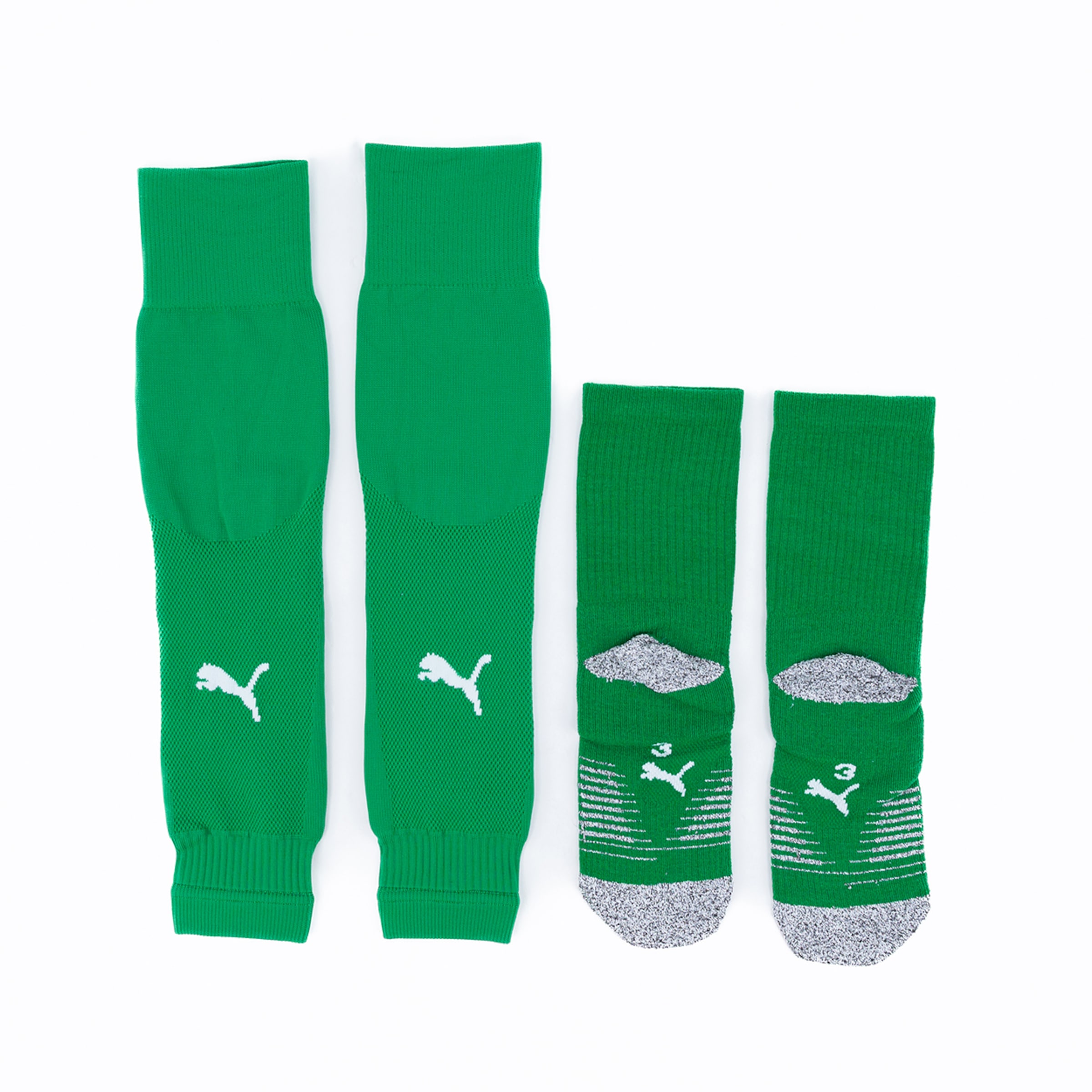 Green football socks and shin guards from Puma available in different sizes.