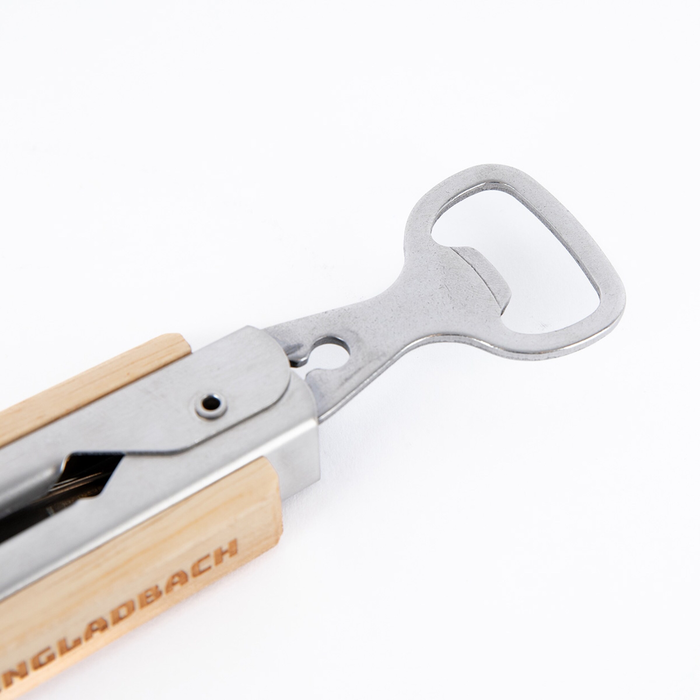 A bottle opener with a wooden handle engraved with BORUSSIA MÖNCHENGLADBACH.