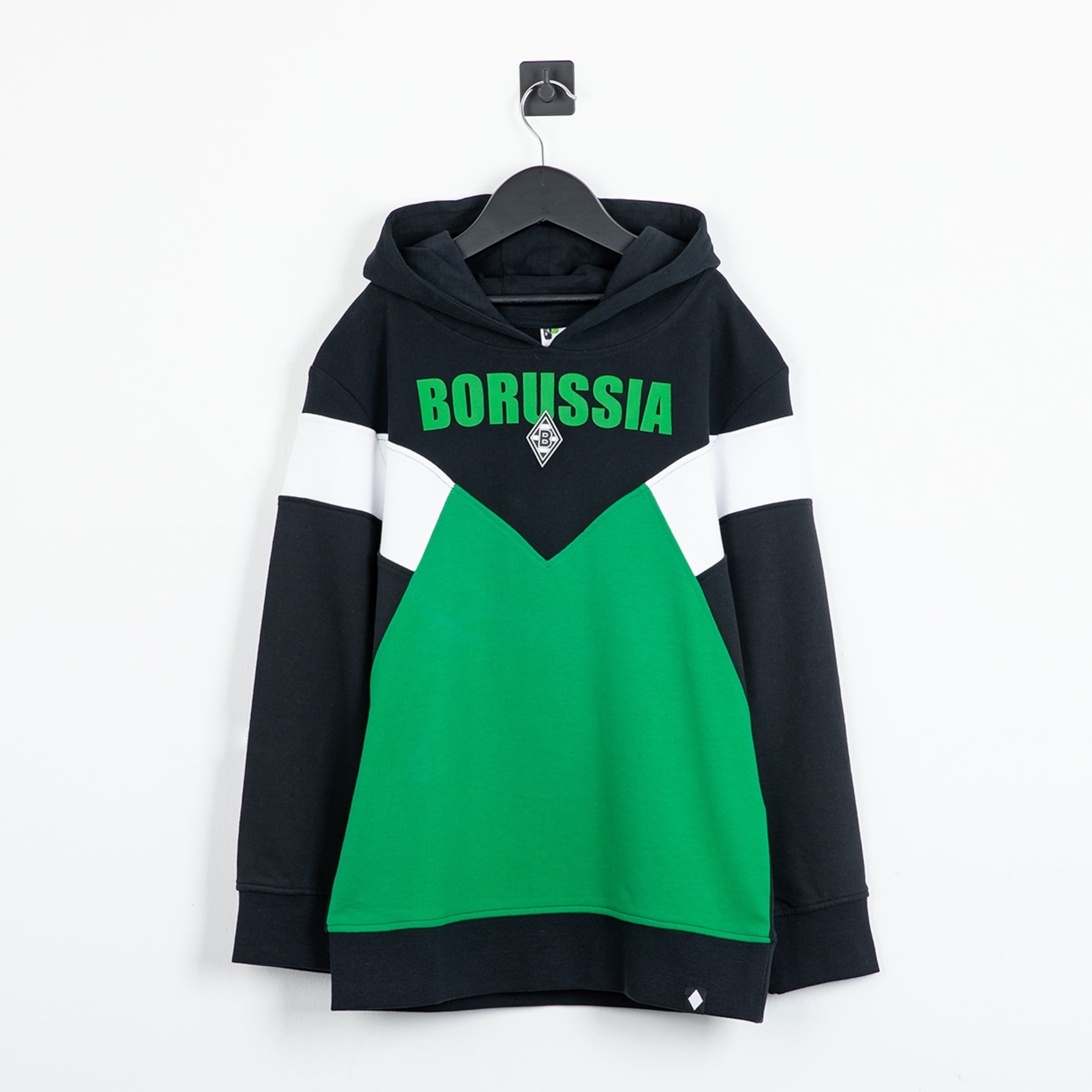 Black hoodie with a green V-shaped panel, white accents, and "BORUSSIA" lettering. Hanging on a black hanger against a white wall.
