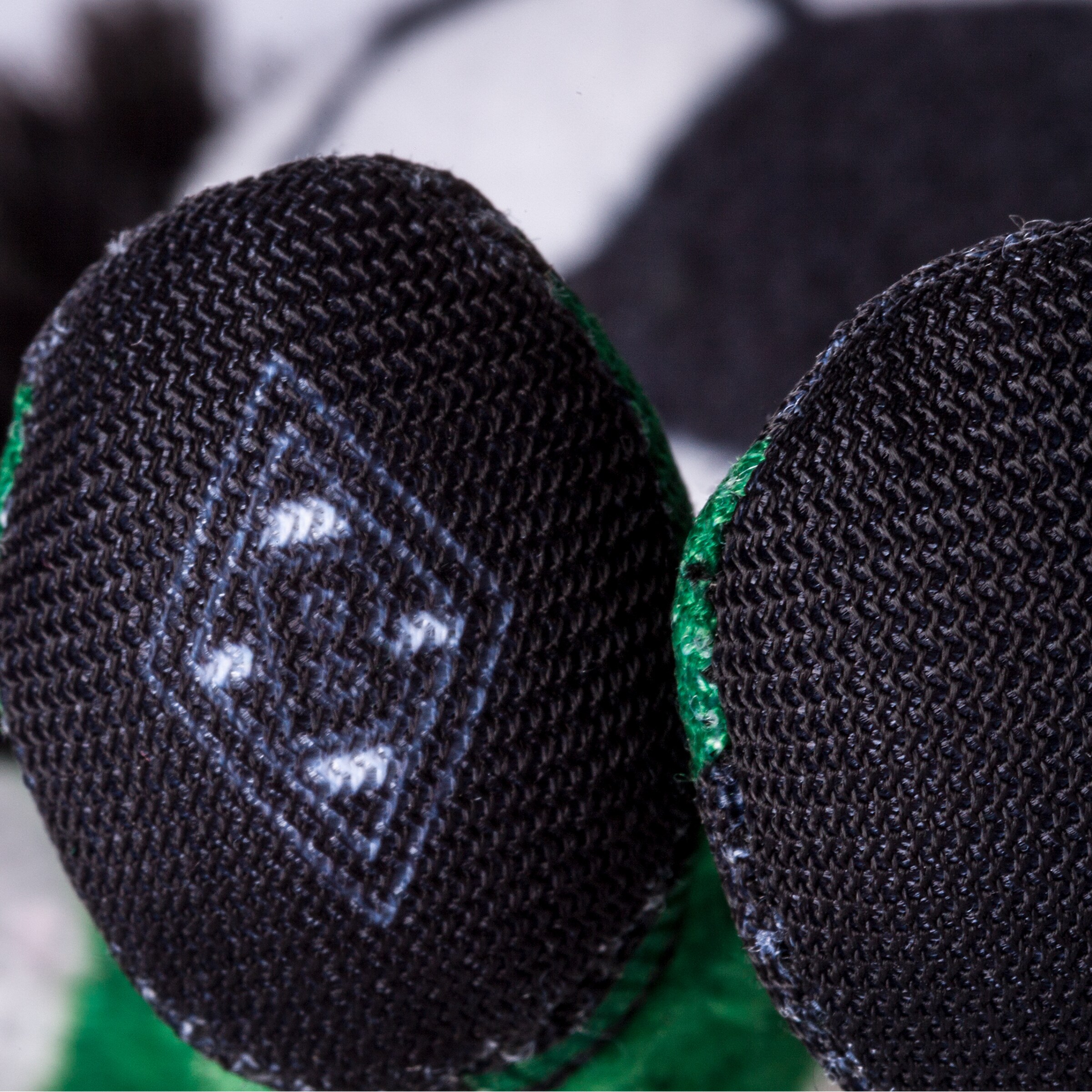 Close-up of a toys feet featuring the Borussia Mönchengladbach logo.