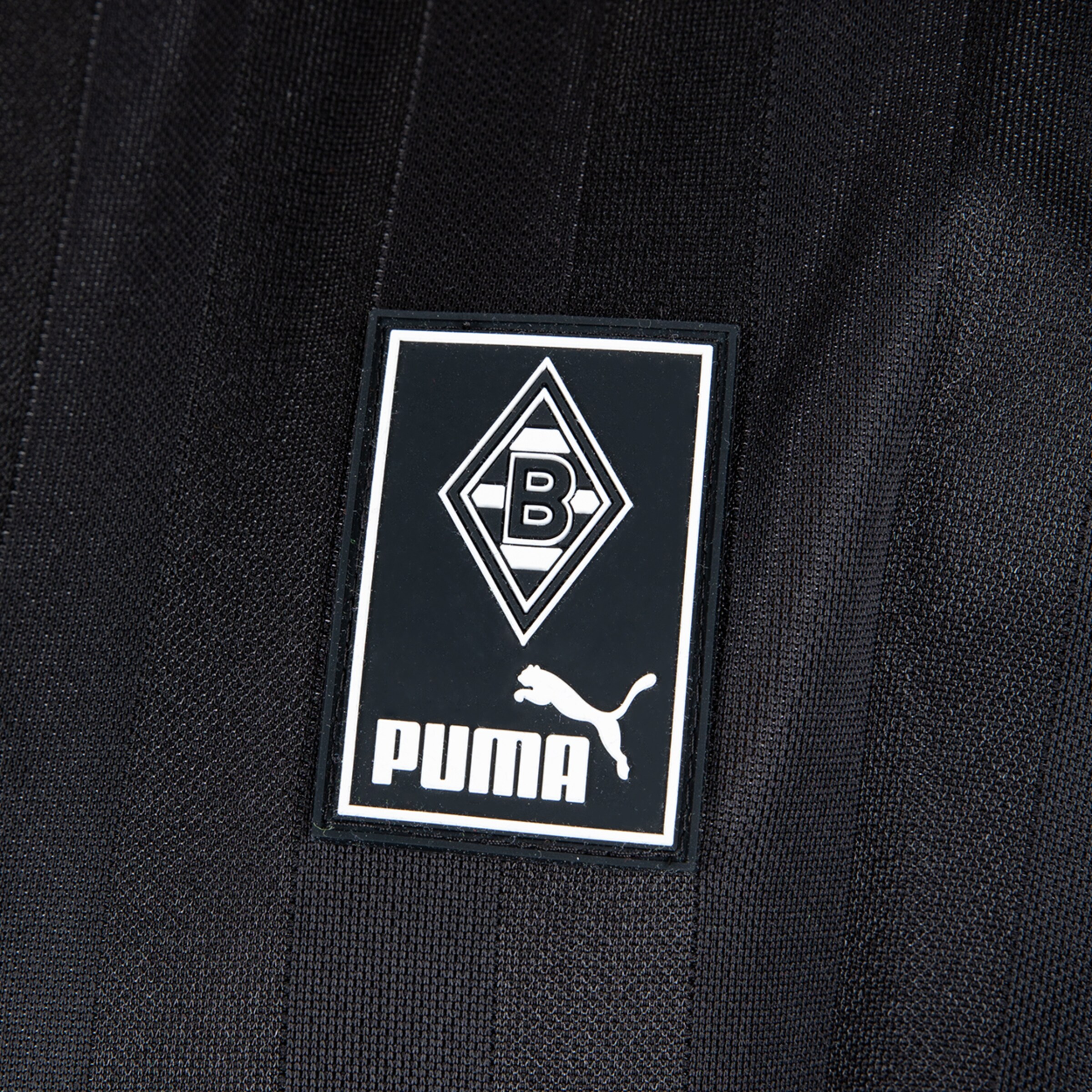 Logo von Borussia Mönchengladbach mit PUMA-Schriftzug.