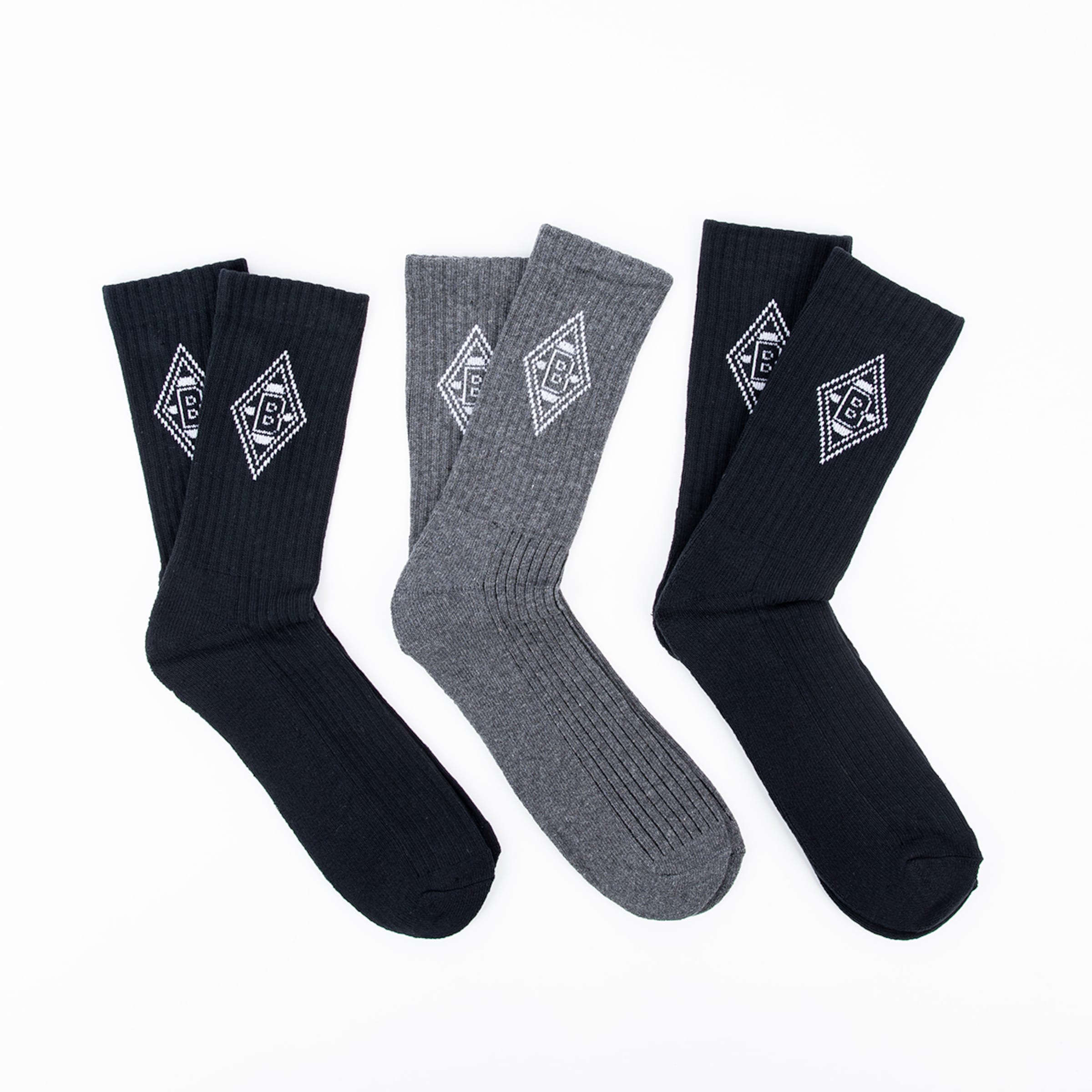 Three pairs of soccer socks in black and gray featuring Borussia Mönchengladbach logo.