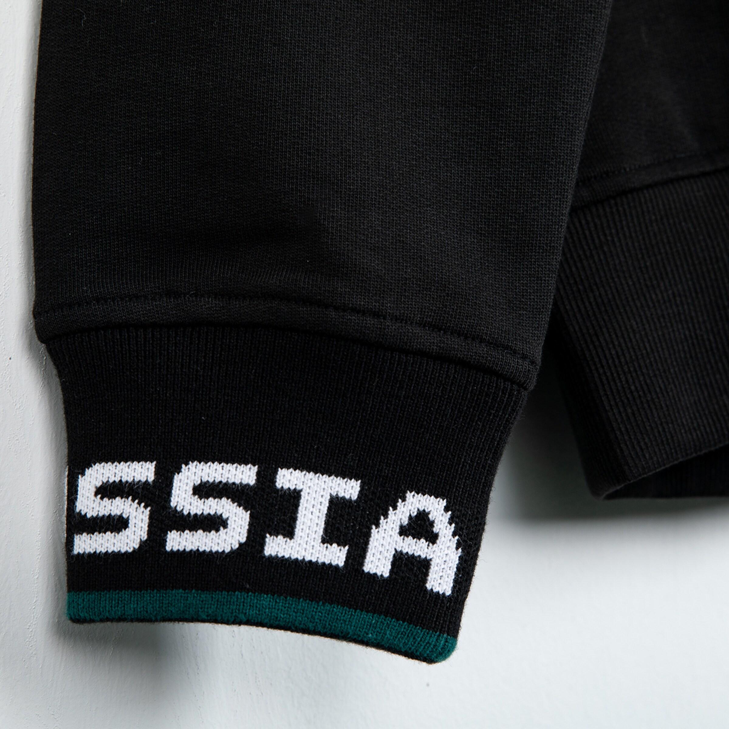 Black sweatshirt with white letters BORUSSIA on the sleeve.
