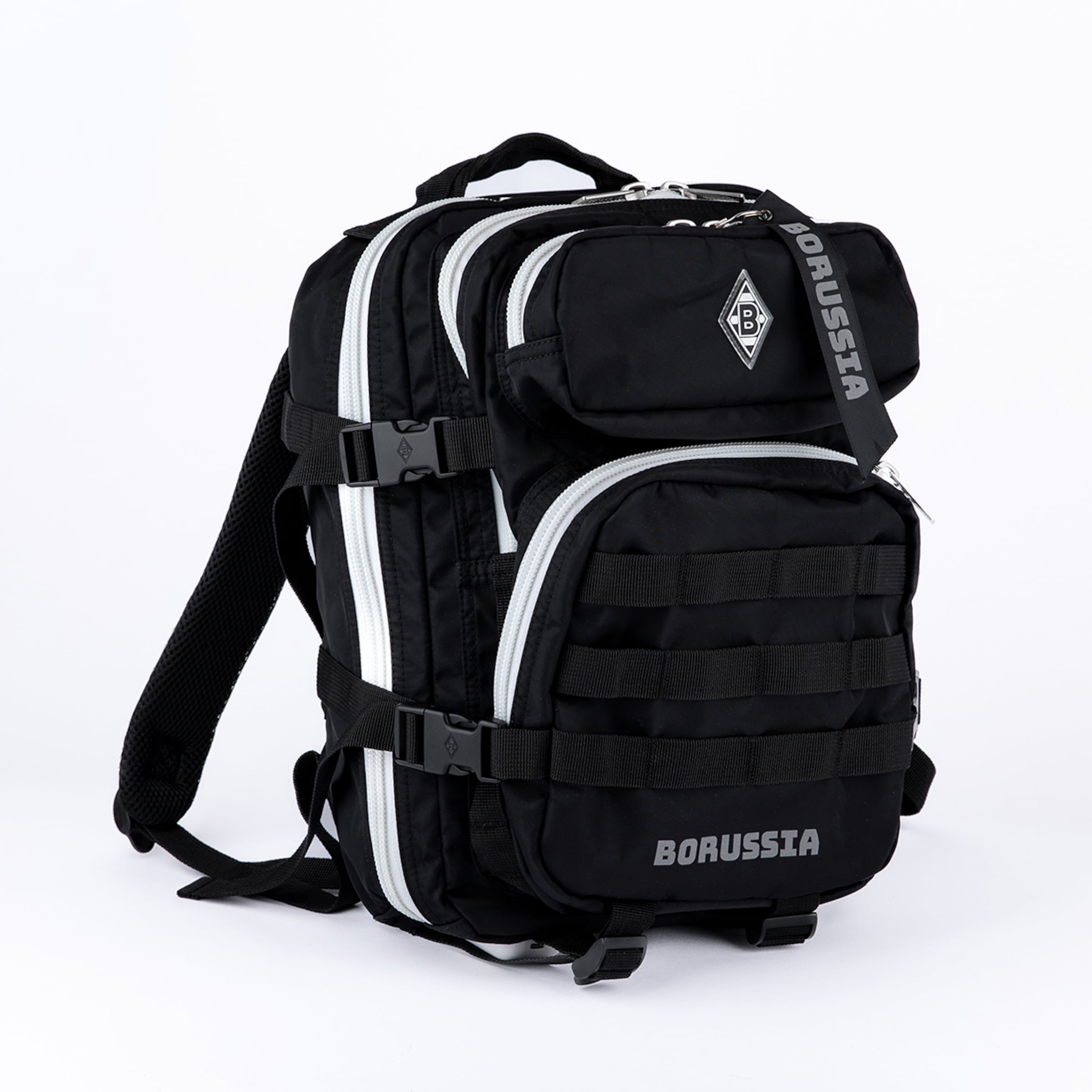 Black Borussia Mönchengladbach backpack with white zippers, side straps, BMG logo badge, 'BORUSSIA' text, and tactical webbing on the front, set against a white background.