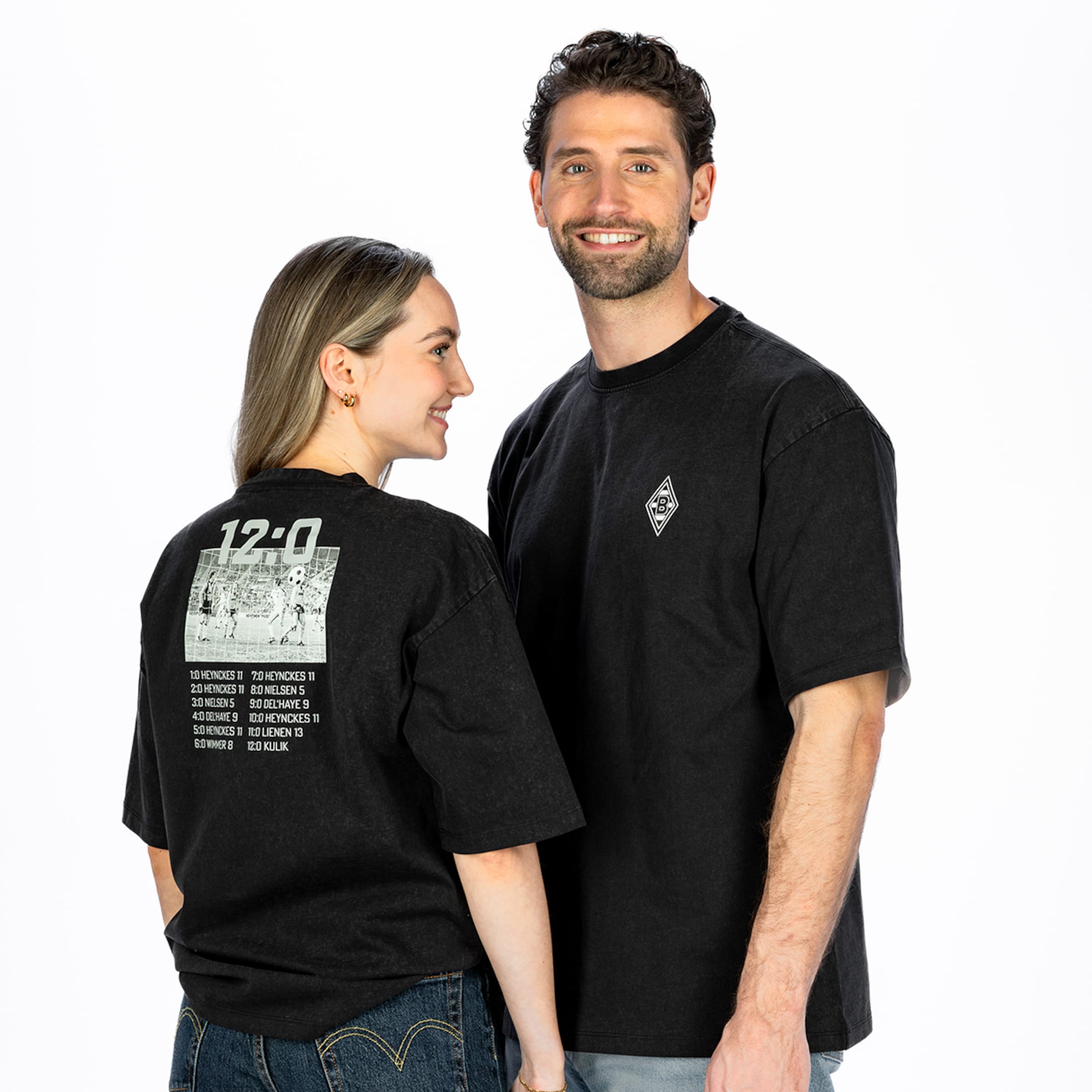 Man and woman in Gladbach shirts. The back displays the goalscorers of the historic 12-0 record victory against Borussia Dortmund.