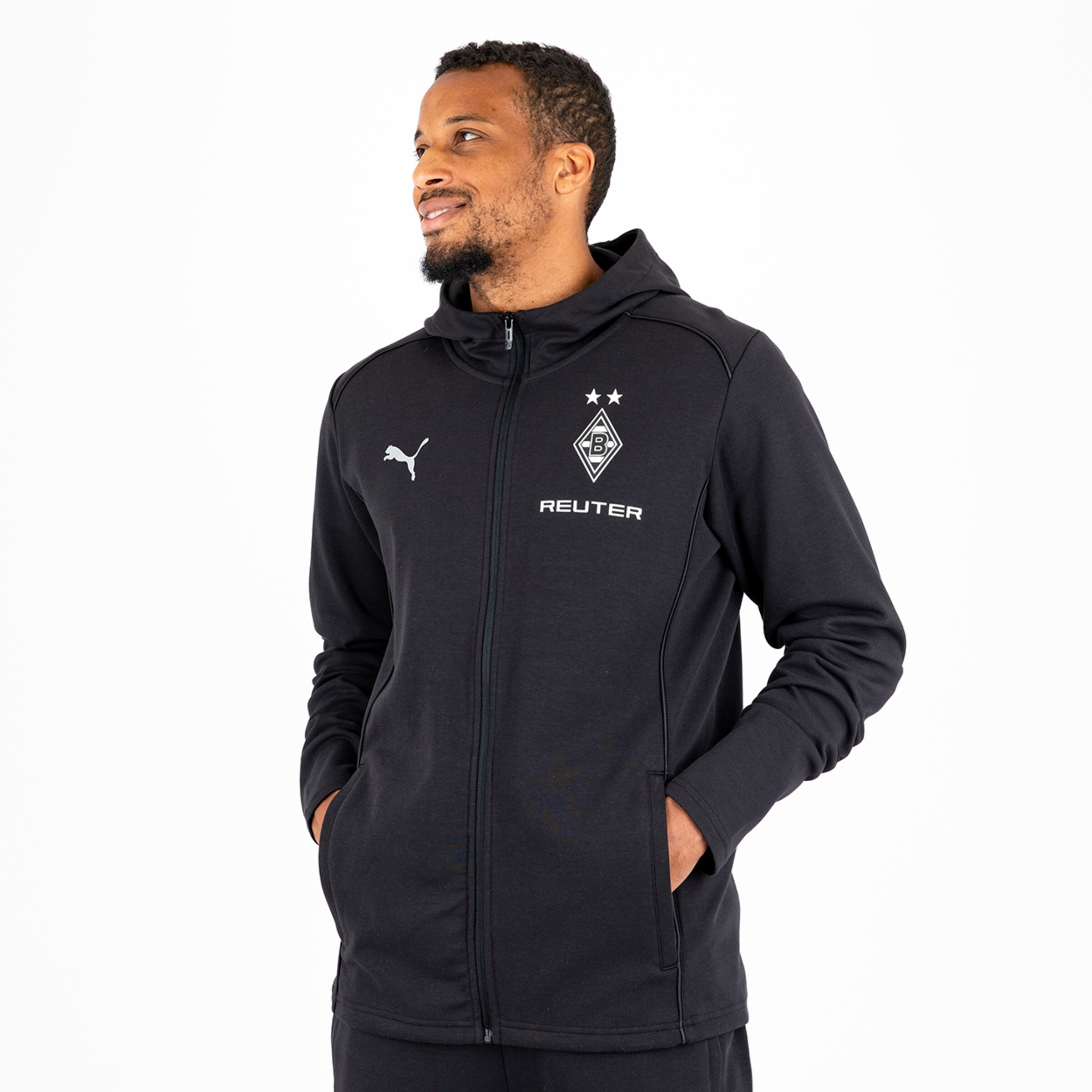 Man wearing a black Borussia Mönchengladbach hoodie with Puma logo.