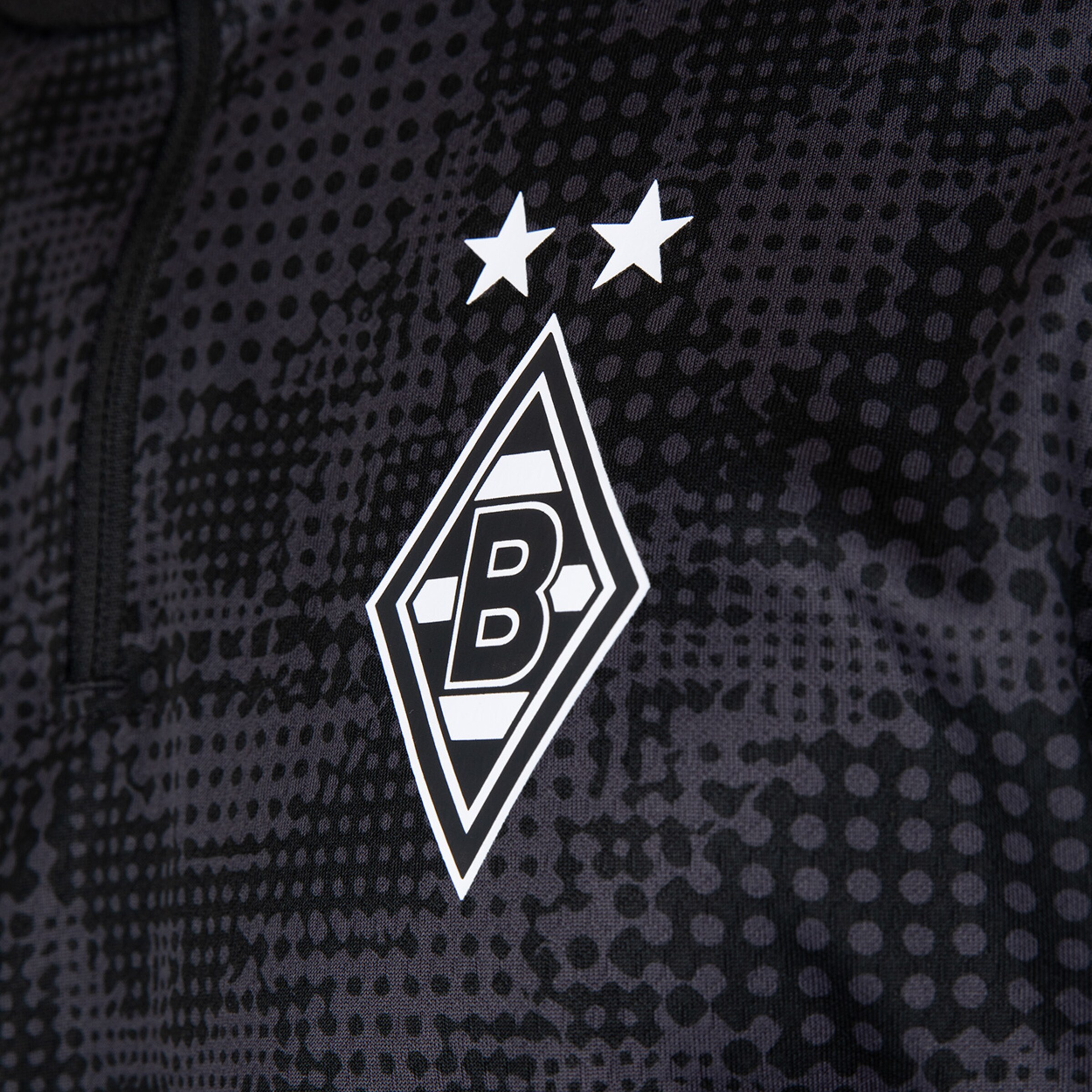 Logo von Borussia Mönchengladbach mit zwei Sternen darüber auf schwarzem Hintergrund.