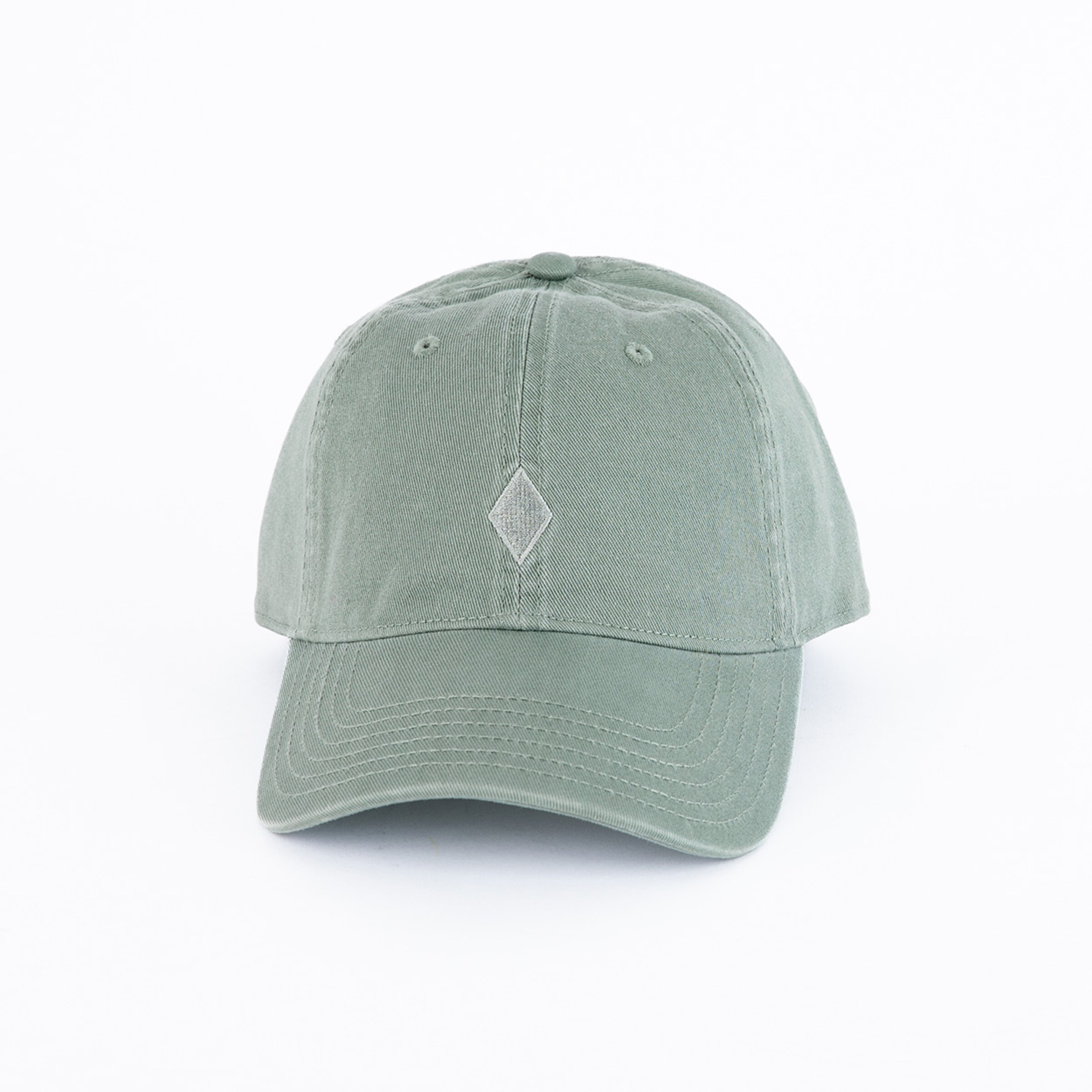 Green baseball cap with stitched diamond symbol.