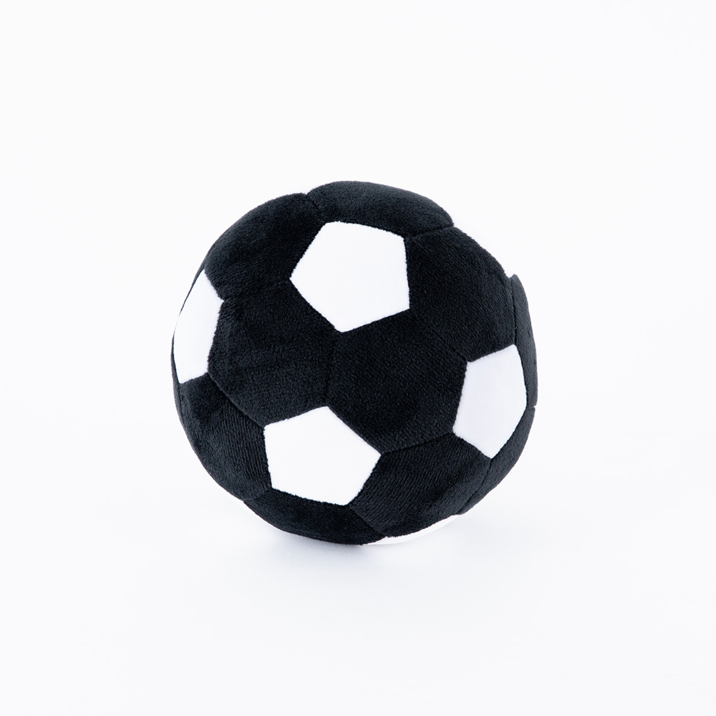 Plush soccer ball with black and white panels.