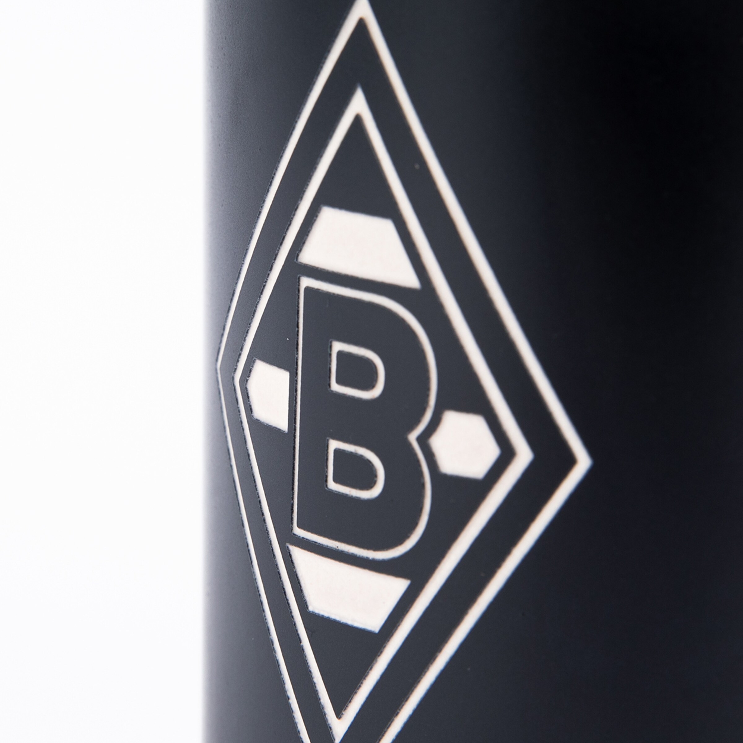 Close-up of Borussia Mönchengladbach logo on a matte background.