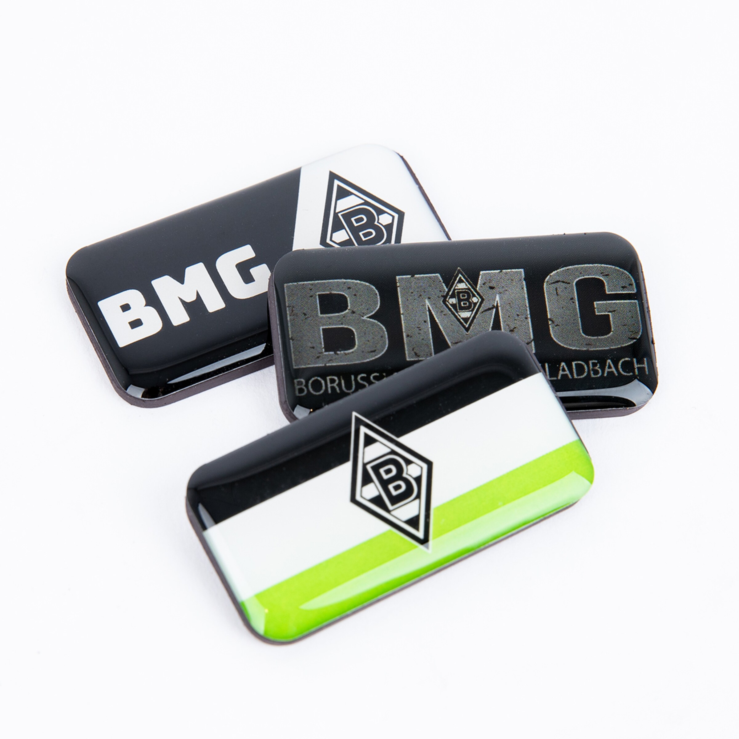 Three magnets featuring the Borussia Mönchengladbach logo and the letters BMG.