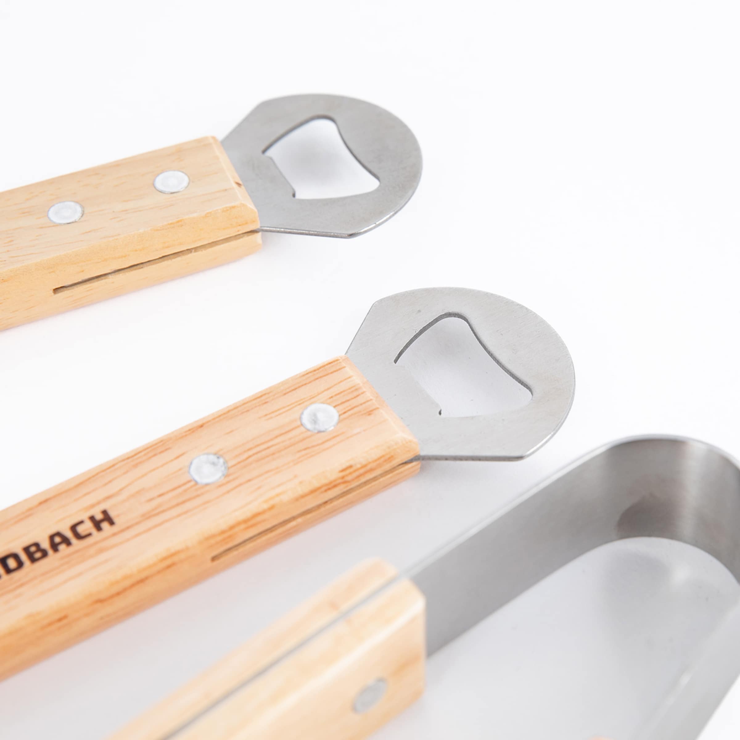 Set of wooden and stainless steel tools with light wooden handles.