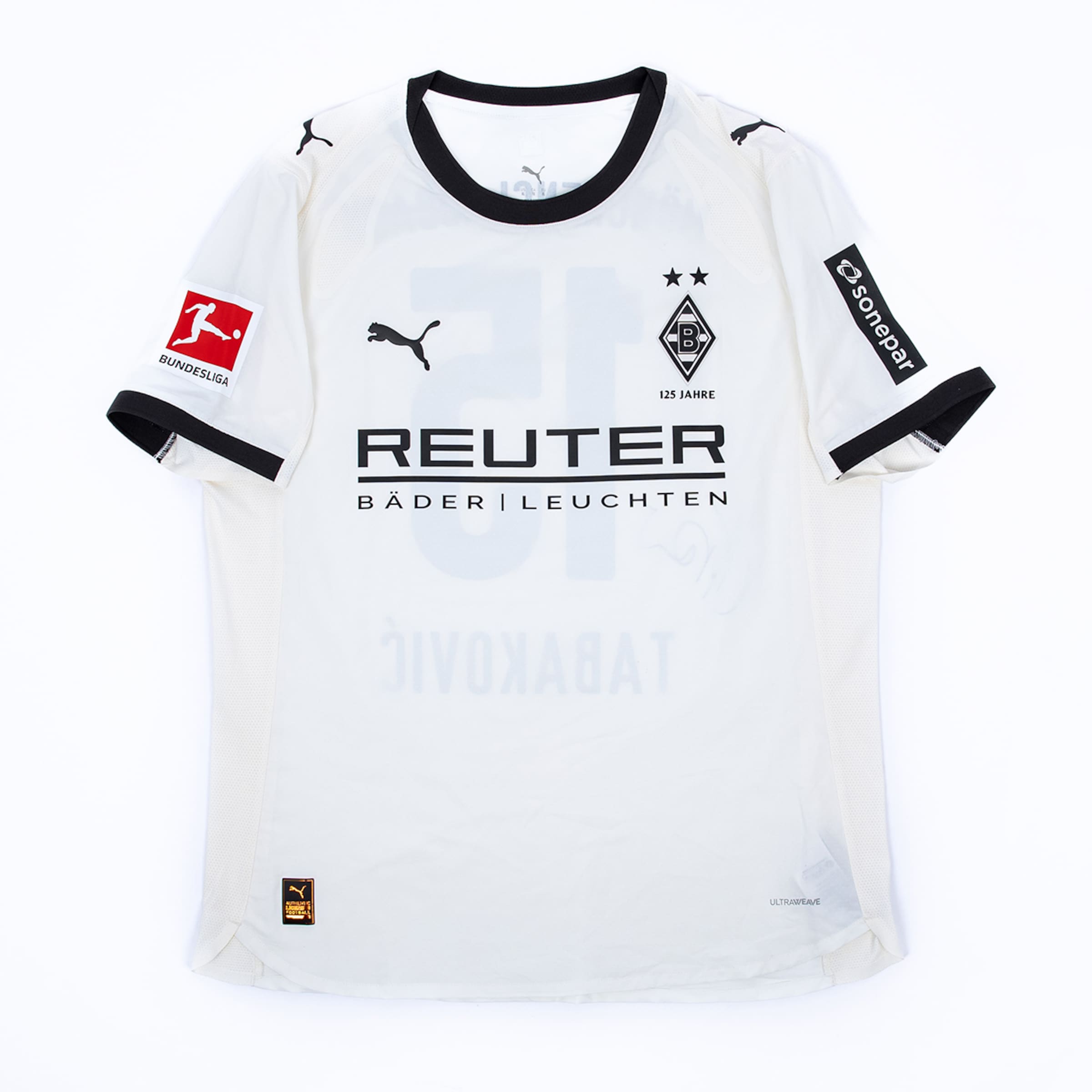 White Puma Borussia Mönchengladbach jersey with black collar, Bundesliga patch, and "REUTER" sponsor logo on the chest.