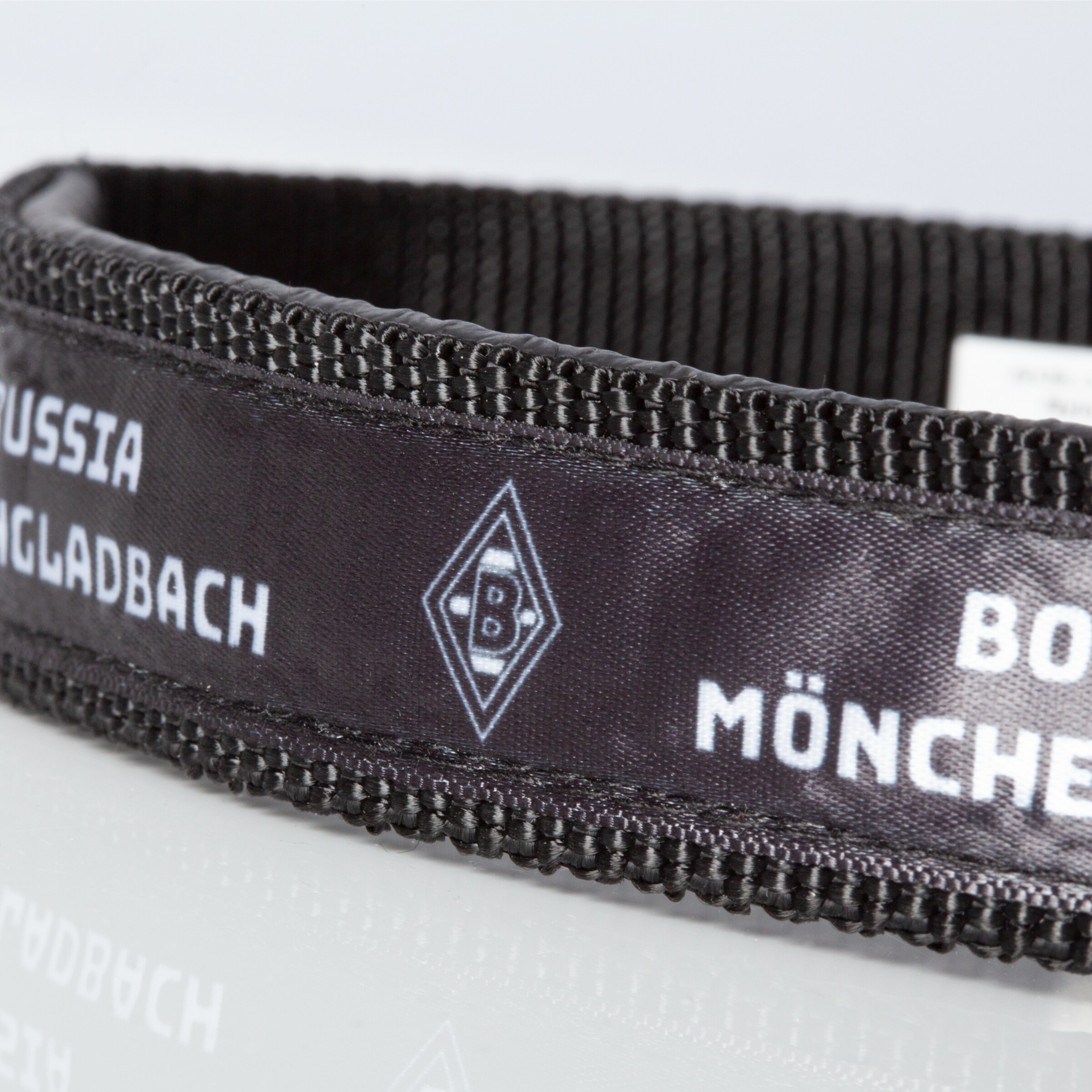 Black sports accessory featuring the text Borussia Mönchengladbach and logo.