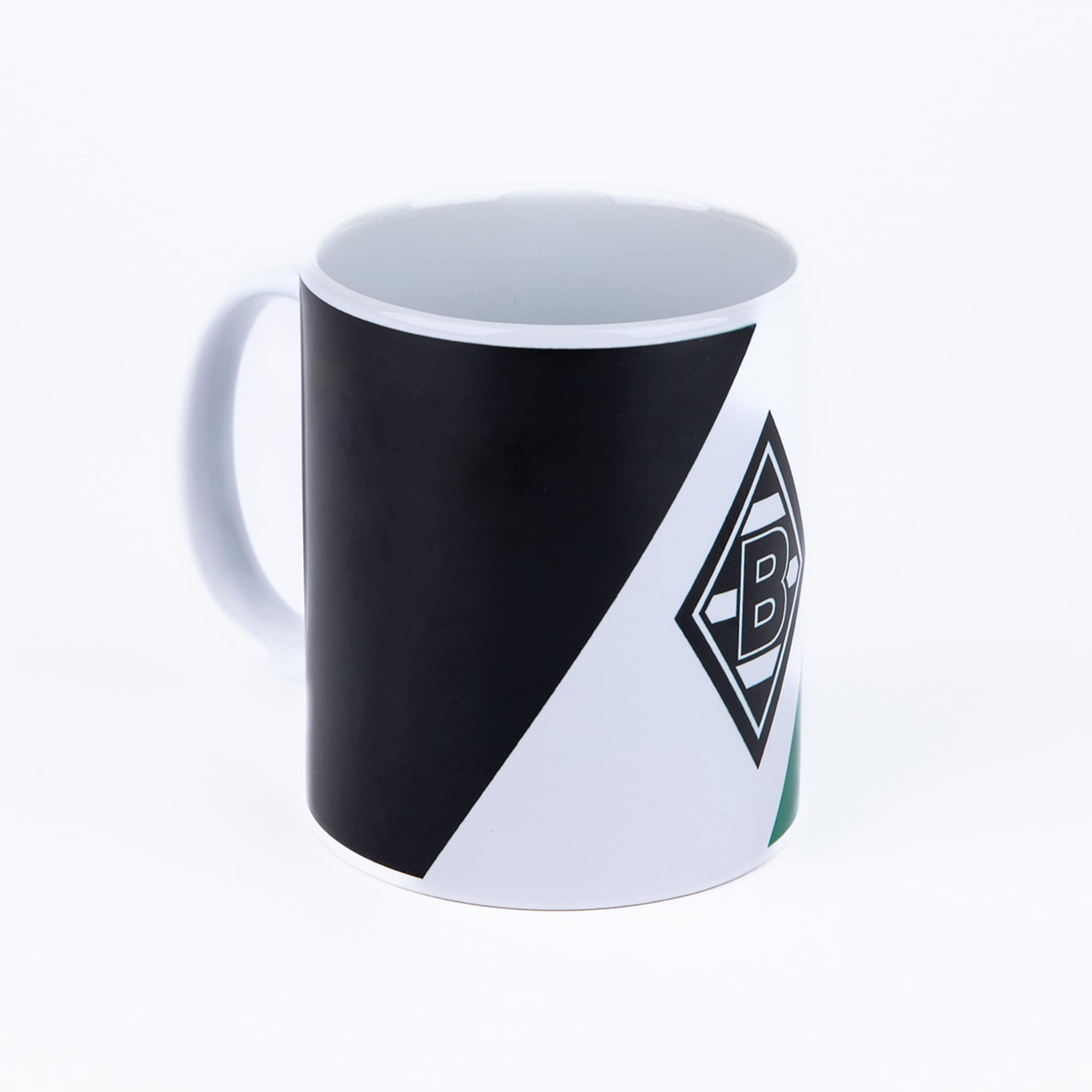 A white mug with a black diagonal band and the black and white logo of Borussia Mönchengladbach (a stylized 'B' in a diamond) with a touch of green, on a white background.