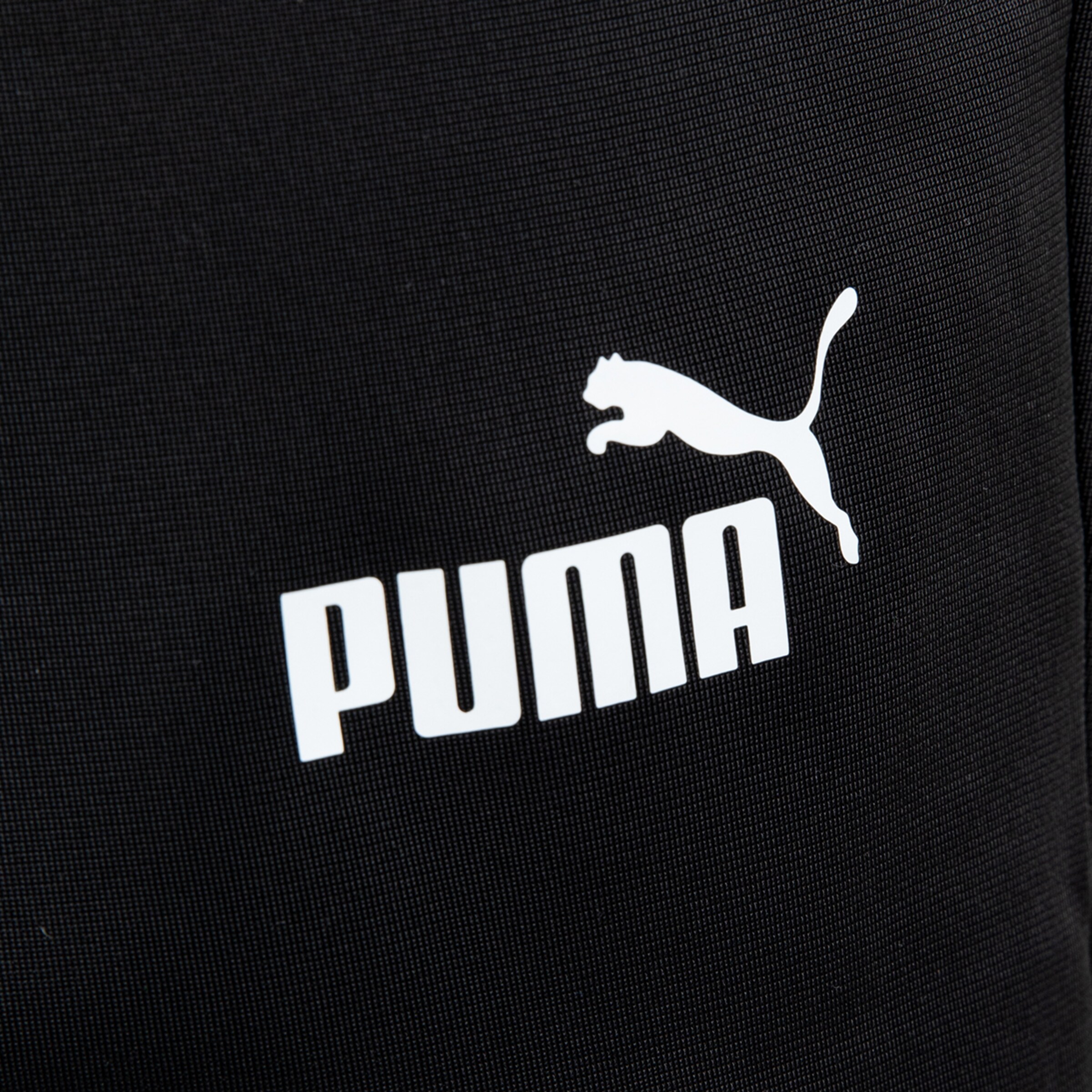 Puma logo on black fabric.
