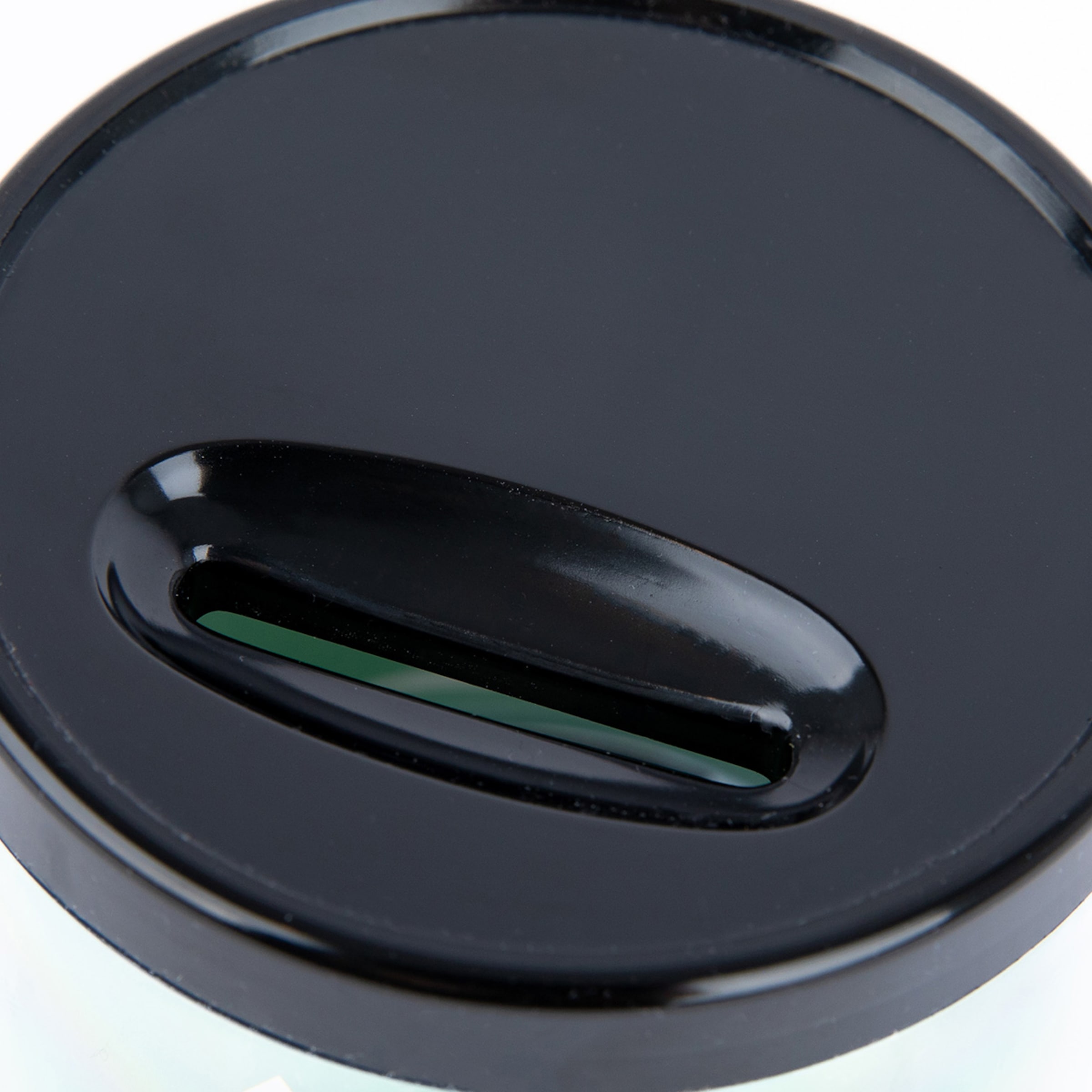 Black lid with a slot for inserting coins.