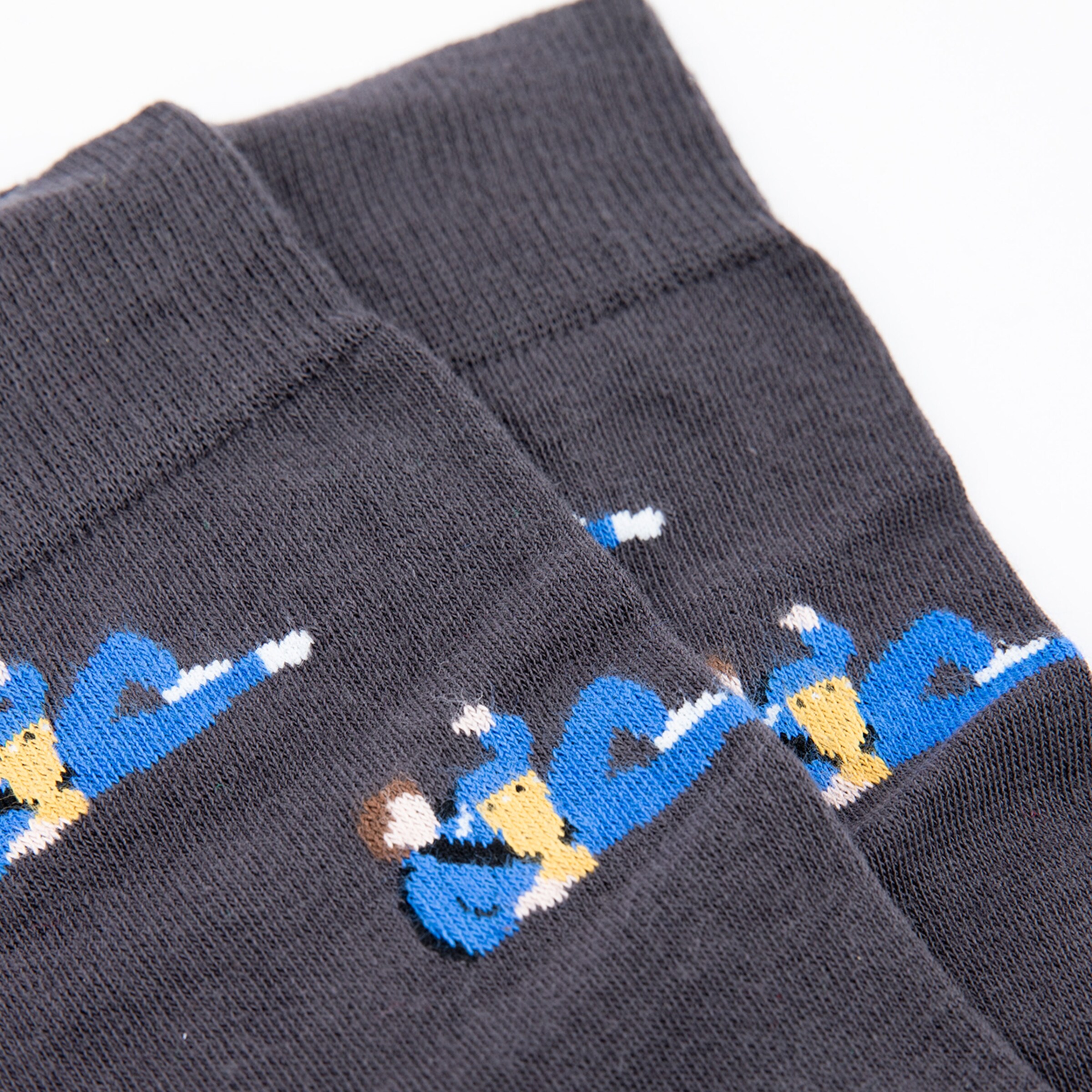Socks in black featuring blue and white player illustrations.