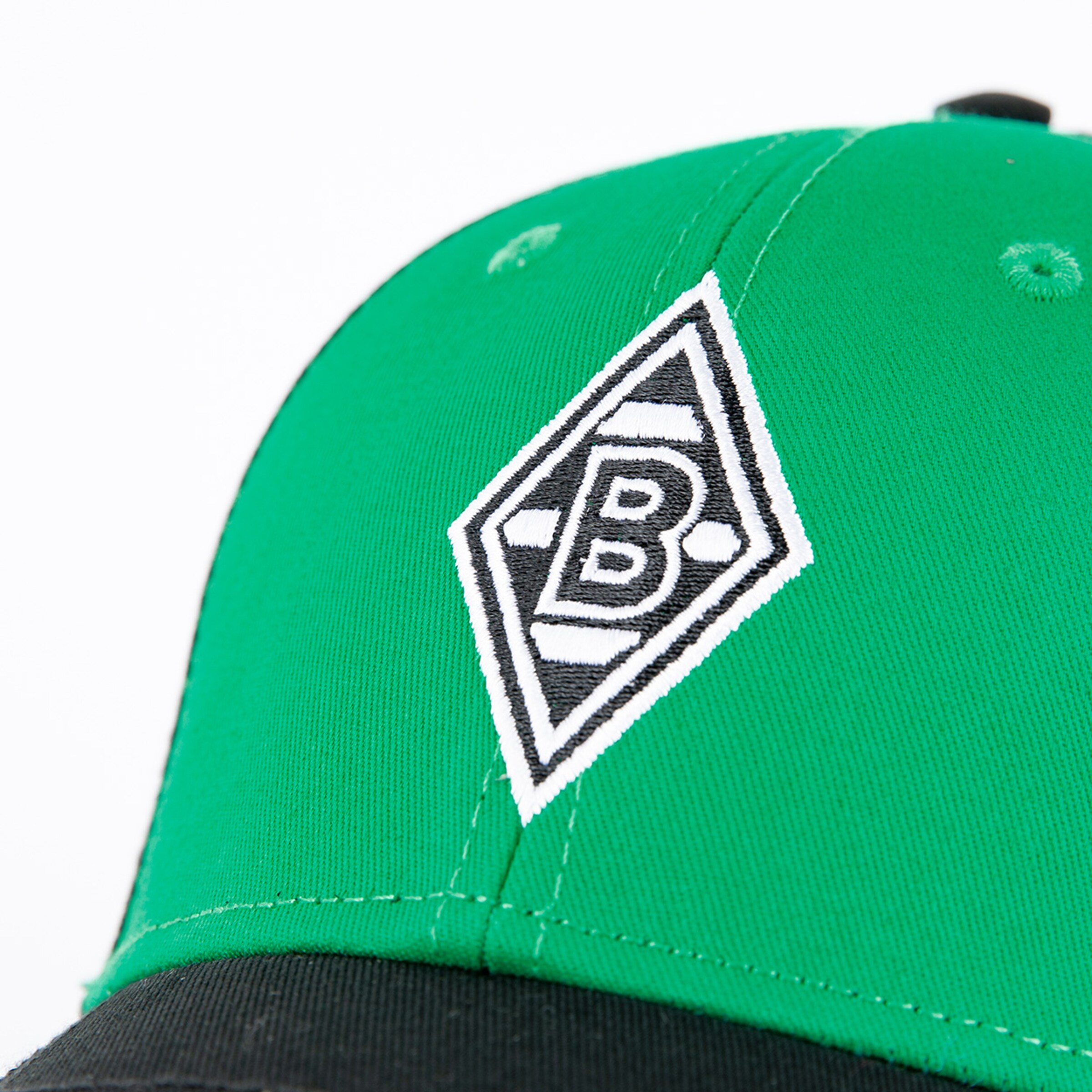 Grüne Baseballmütze mit dem Borussia Mönchengladbach-Logo in der Mitte.
