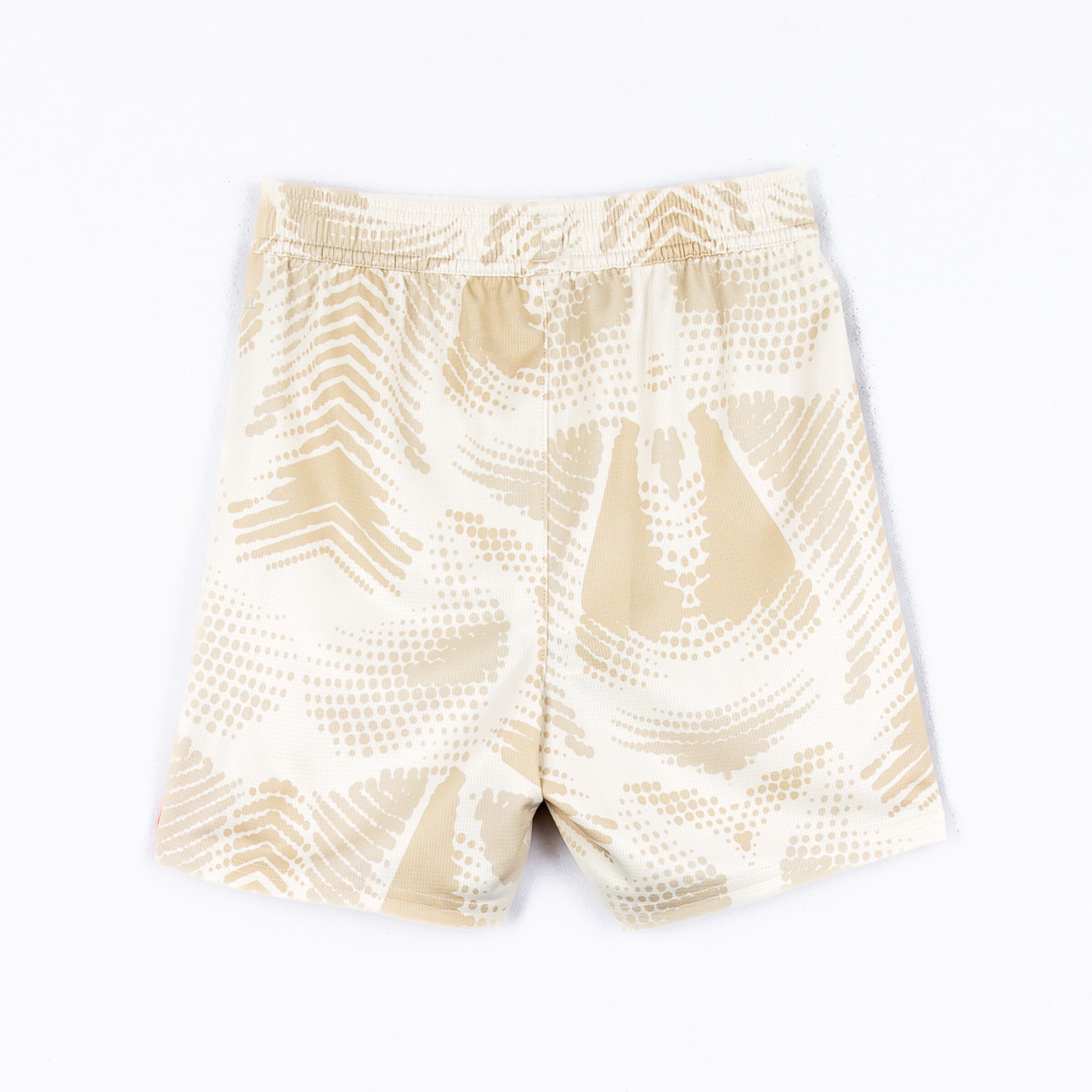 Beige swim shorts with a geometric pattern and elastic waistband.