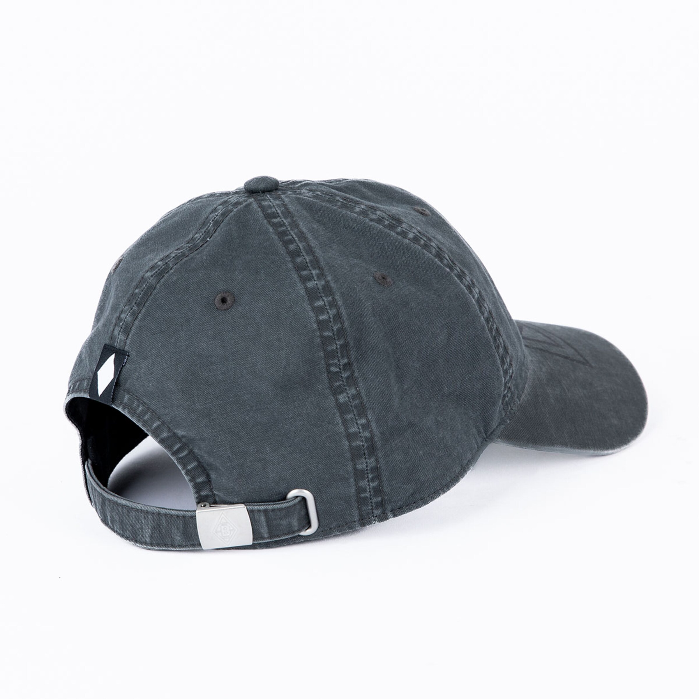 Rear view of a dark grey washed cotton baseball cap with an adjustable metal buckle and a small side logo tag.