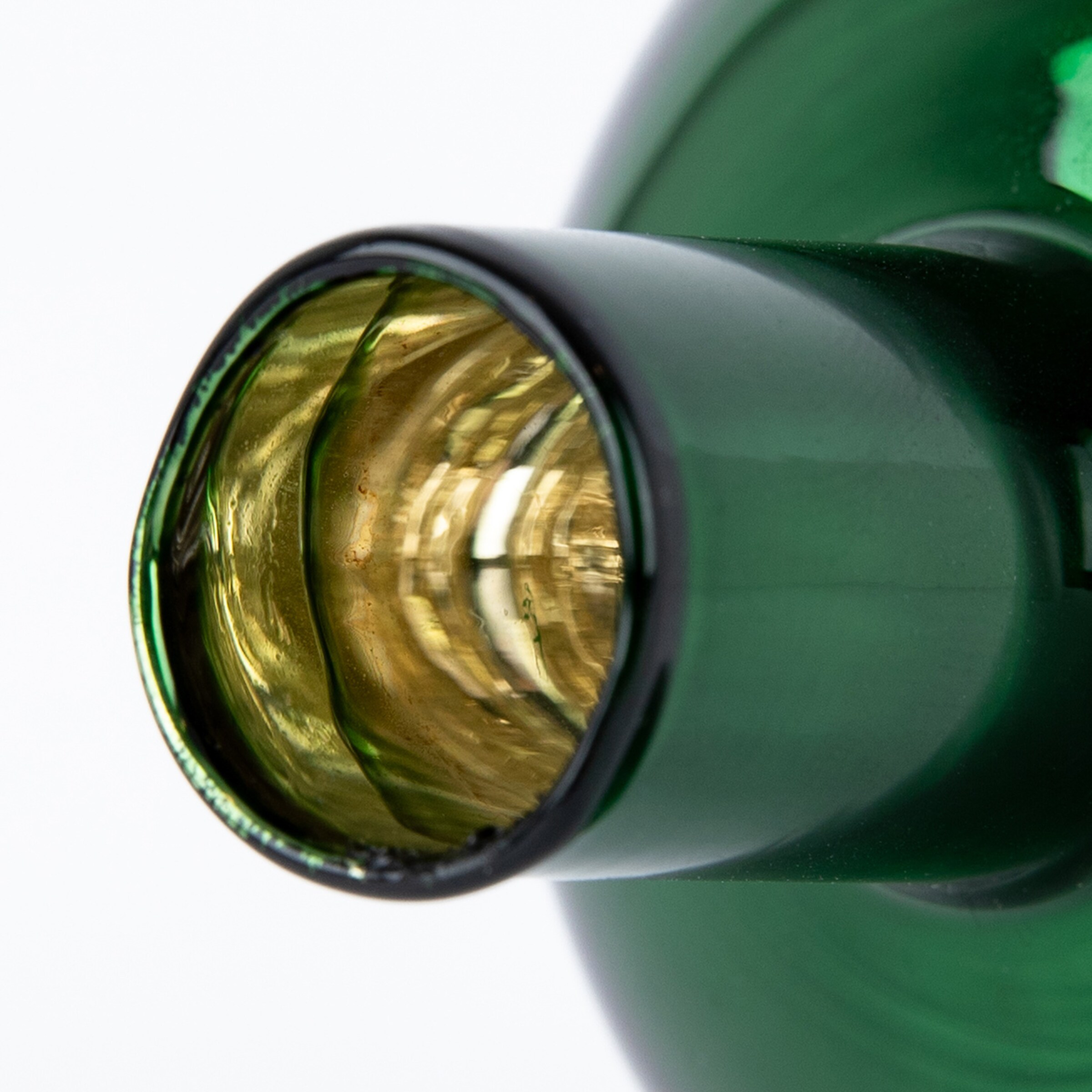 Top view of a green glass bottle neck showing slight reflections inside.
