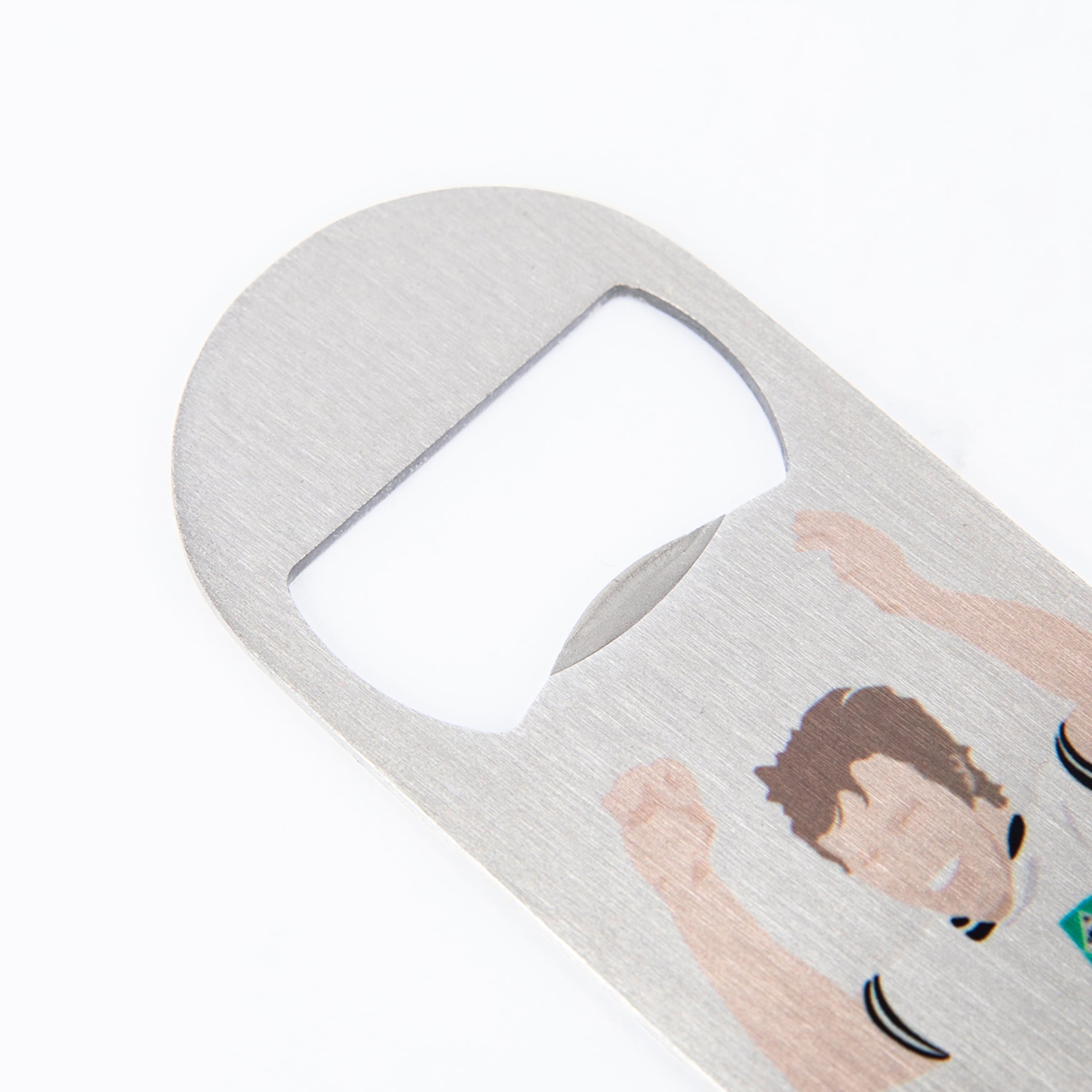Close-up of a silver metal bottle opener with a printed illustration of a cheering man with brown hair on a white background.