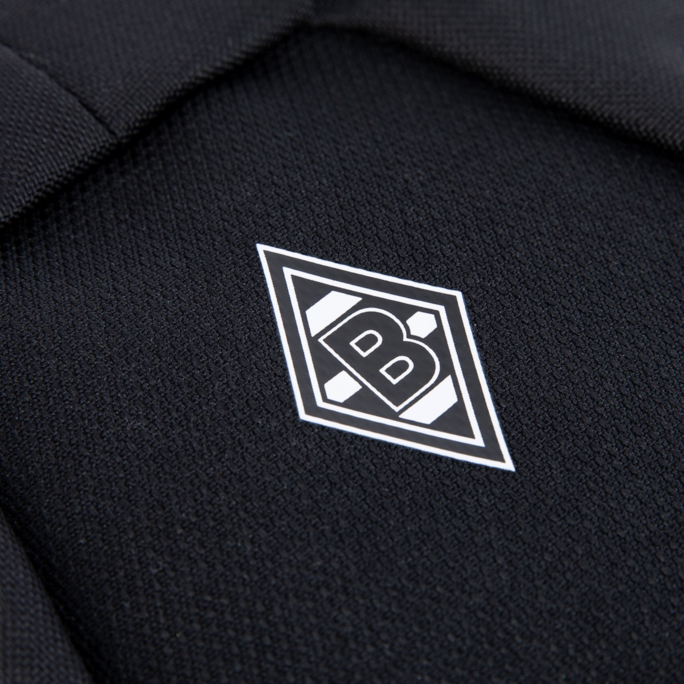Schwarzes Stück Stoff mit dem Borussia Mönchengladbach Logo darauf.