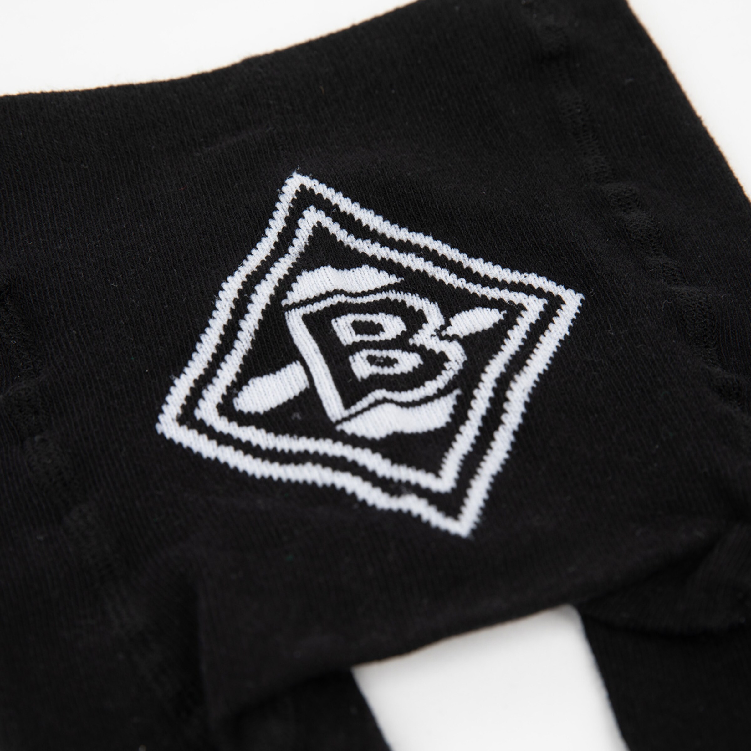 Black socks featuring the Borussia Mönchengladbach logo.