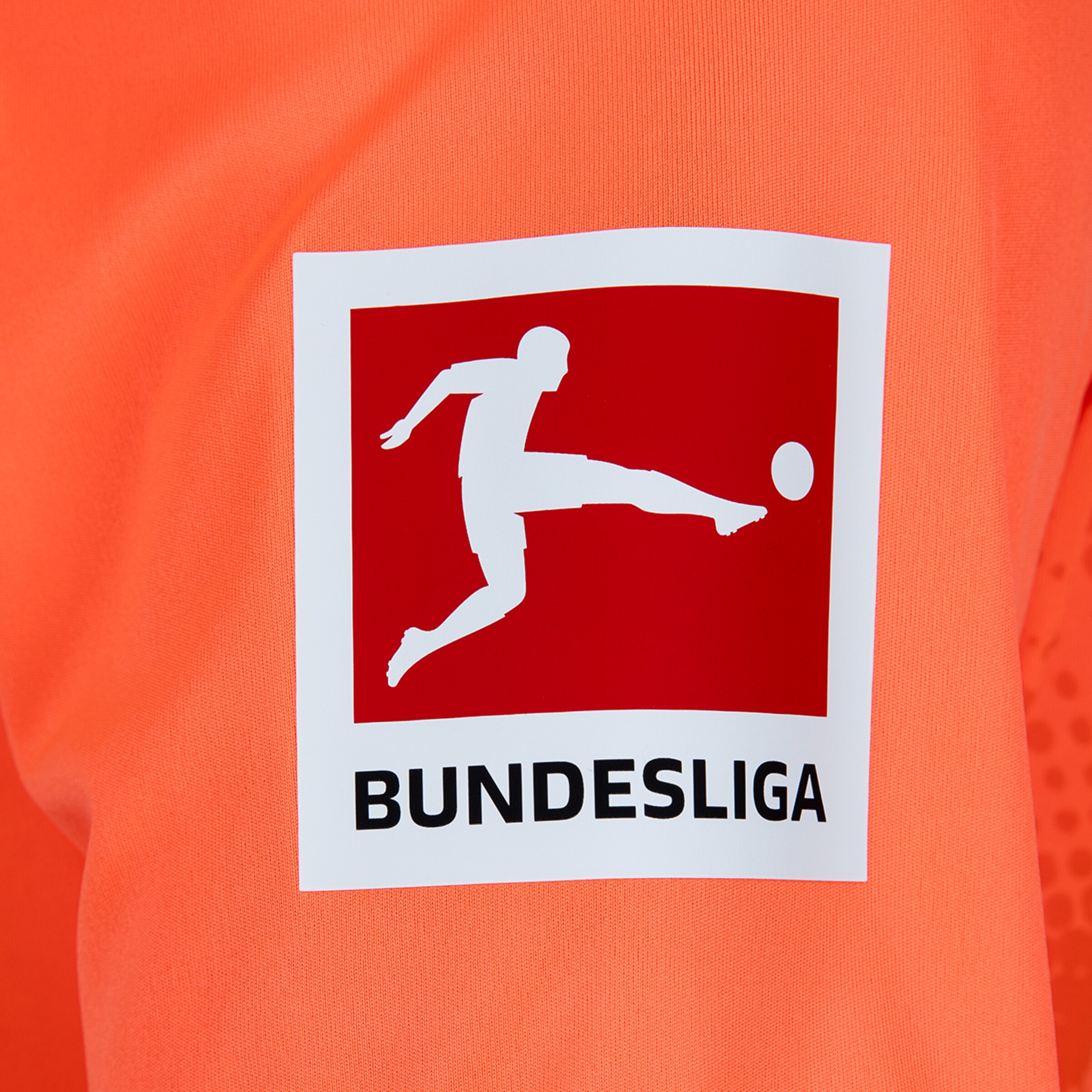 Bundesliga logo on orange fabric: Red square with a white player silhouette above the black BUNDESLIGA wordmark.