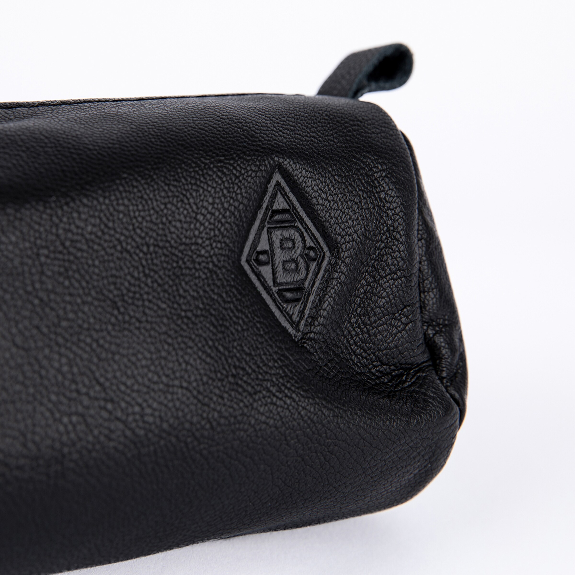 Close-up of a black leather pouch with a pebbled texture and the debossed diamond-shaped VfL Borussia Mönchengladbach logo, set against a white background.