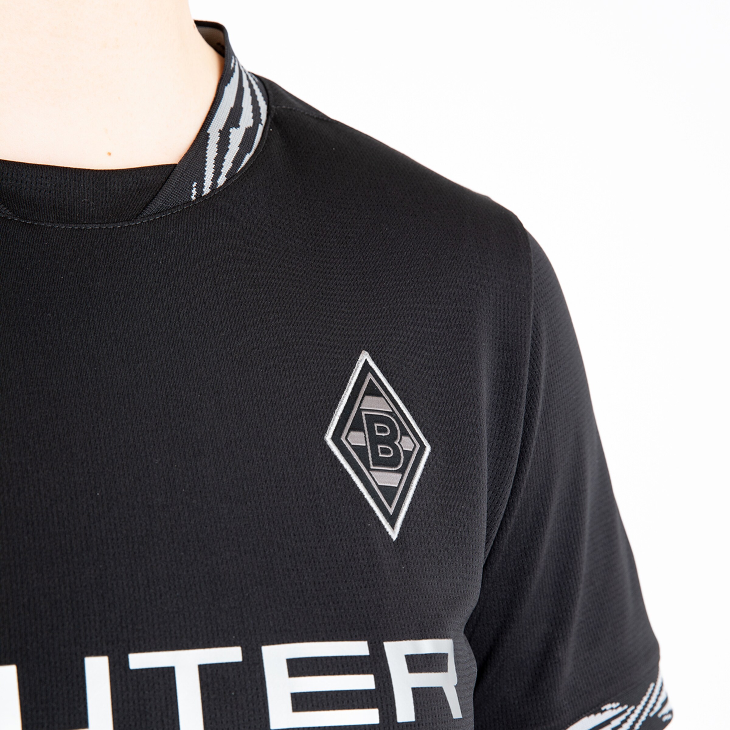 Schwarz trikot mit Borussia Mönchengladbach Logo und Text JÜNTER.