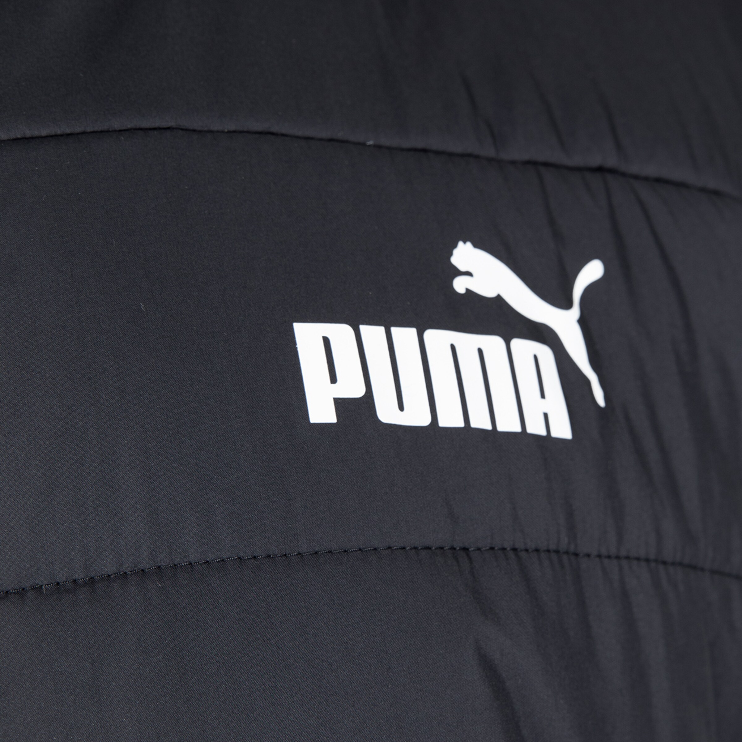 Puma logo on black jacket