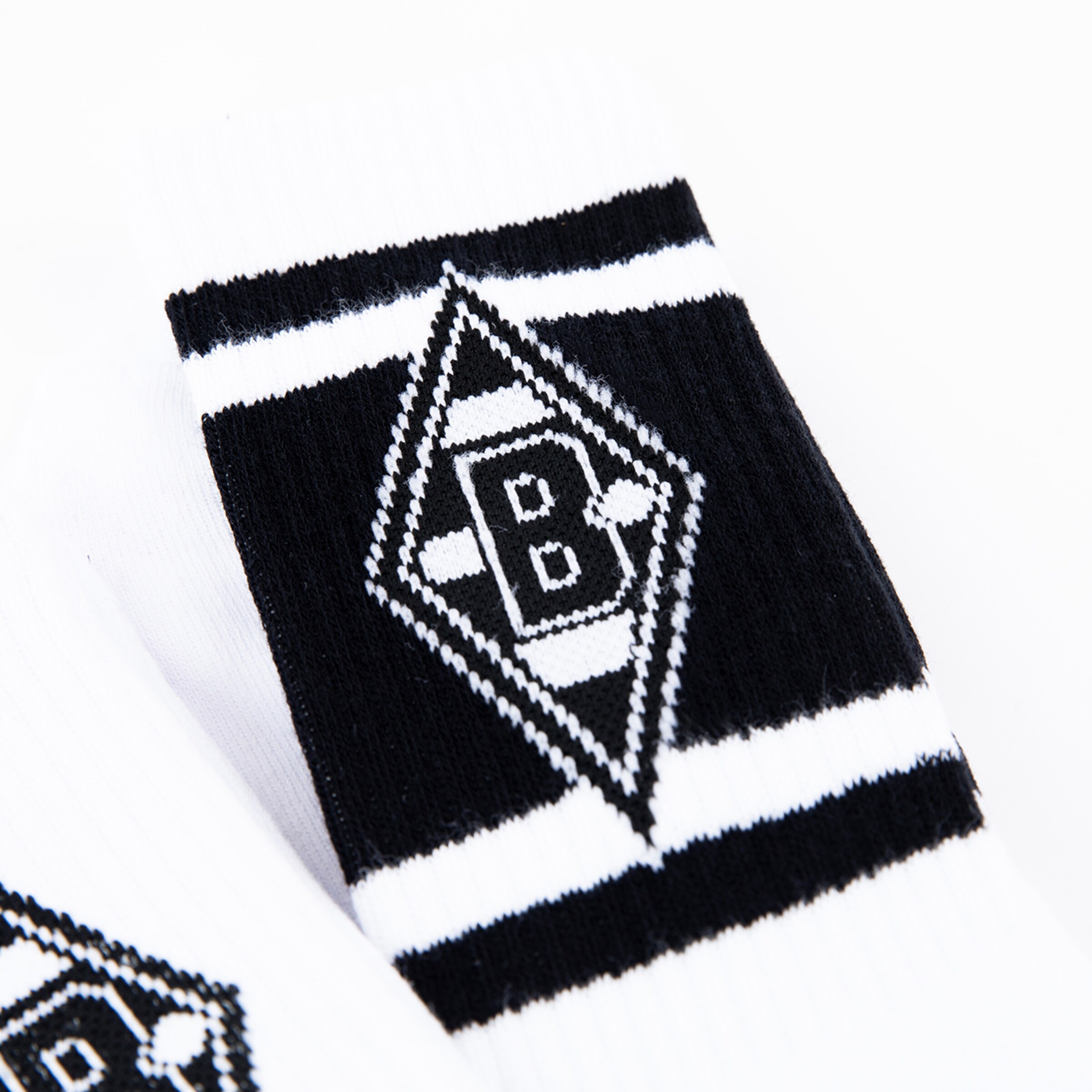 Socks featuring the Borussia Mönchengladbach logo in black and white.