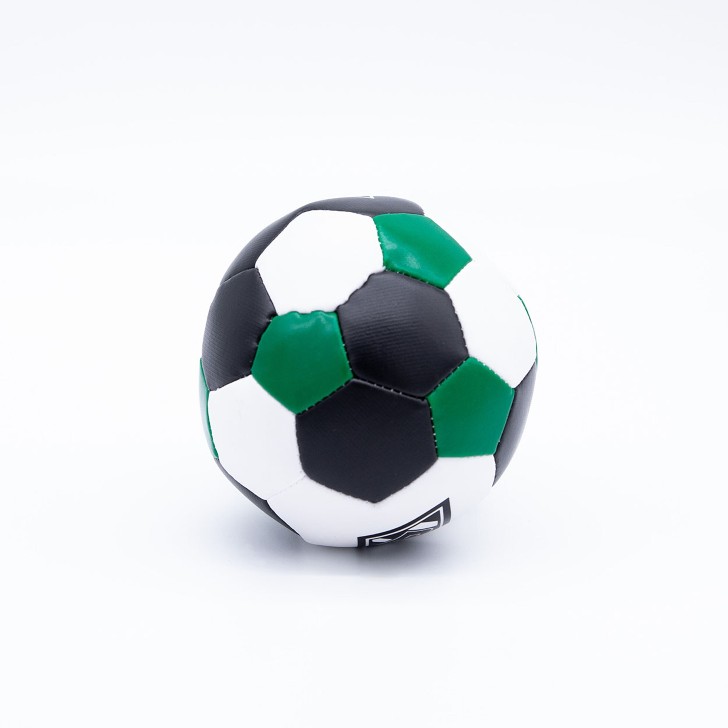 A soccer ball in black white and green