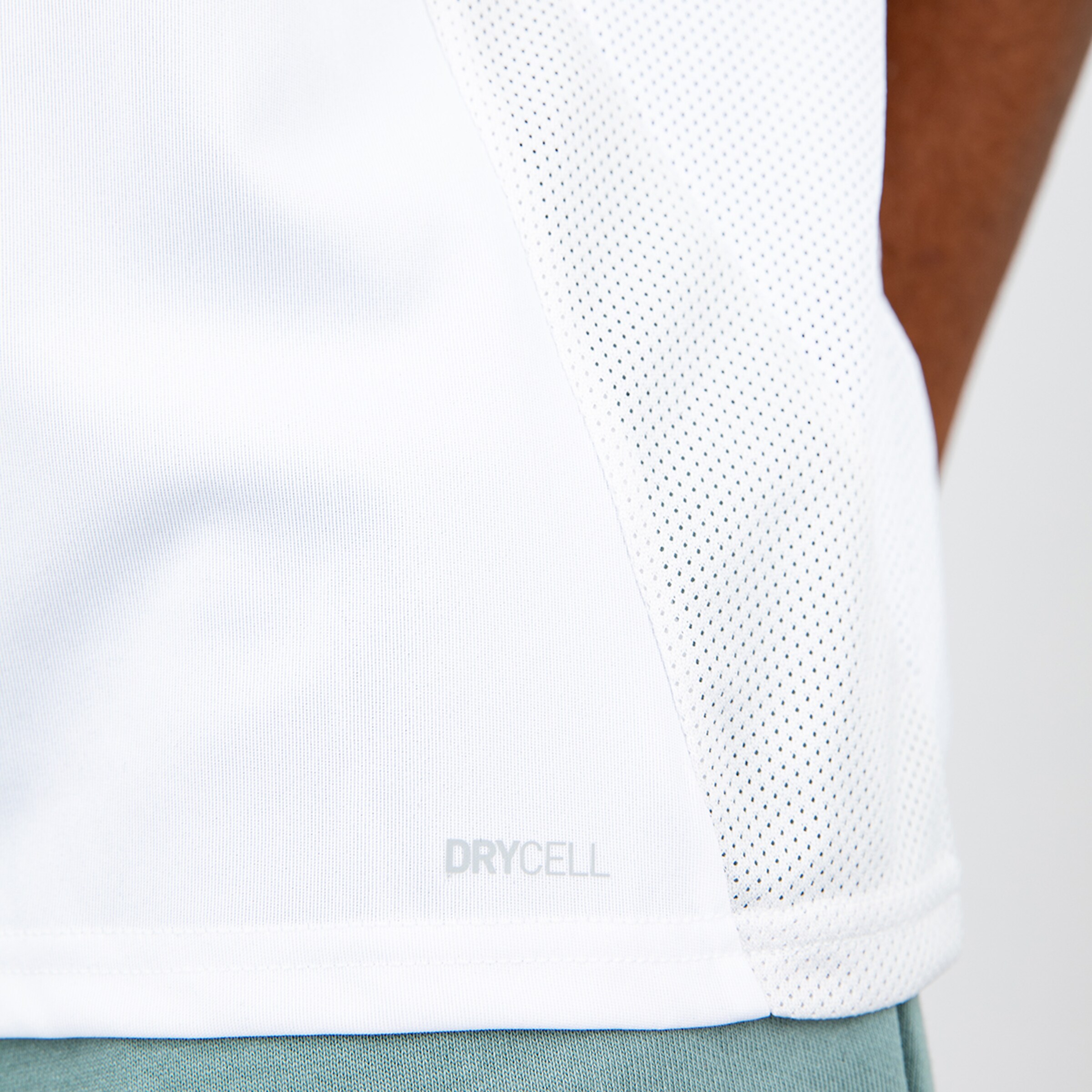 Close-up of a white sports jersey with DRYCELL text at the hem.