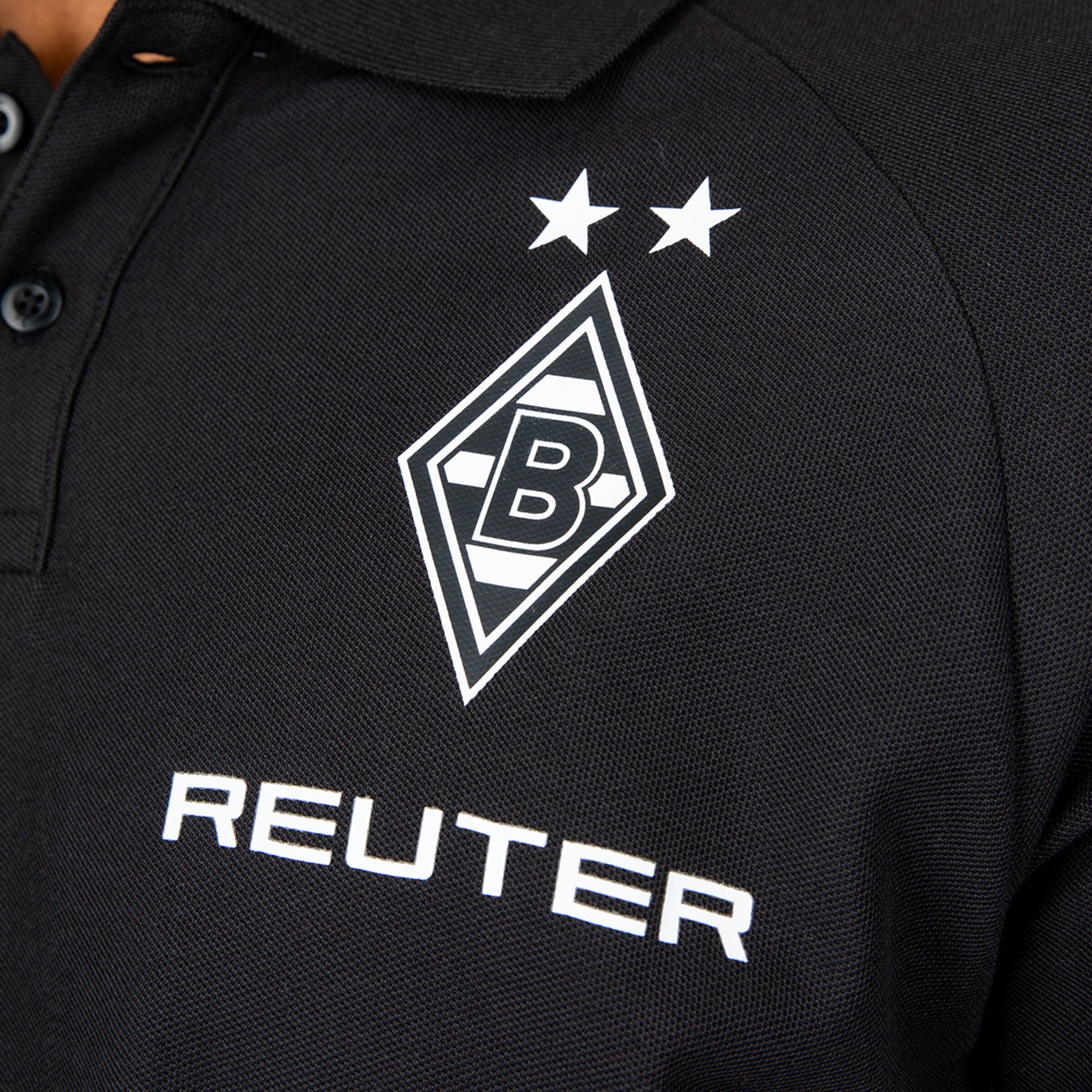 Polo-Shirt mit dem Borussia Mönchengladbach-Logo und dem Namen REUTER