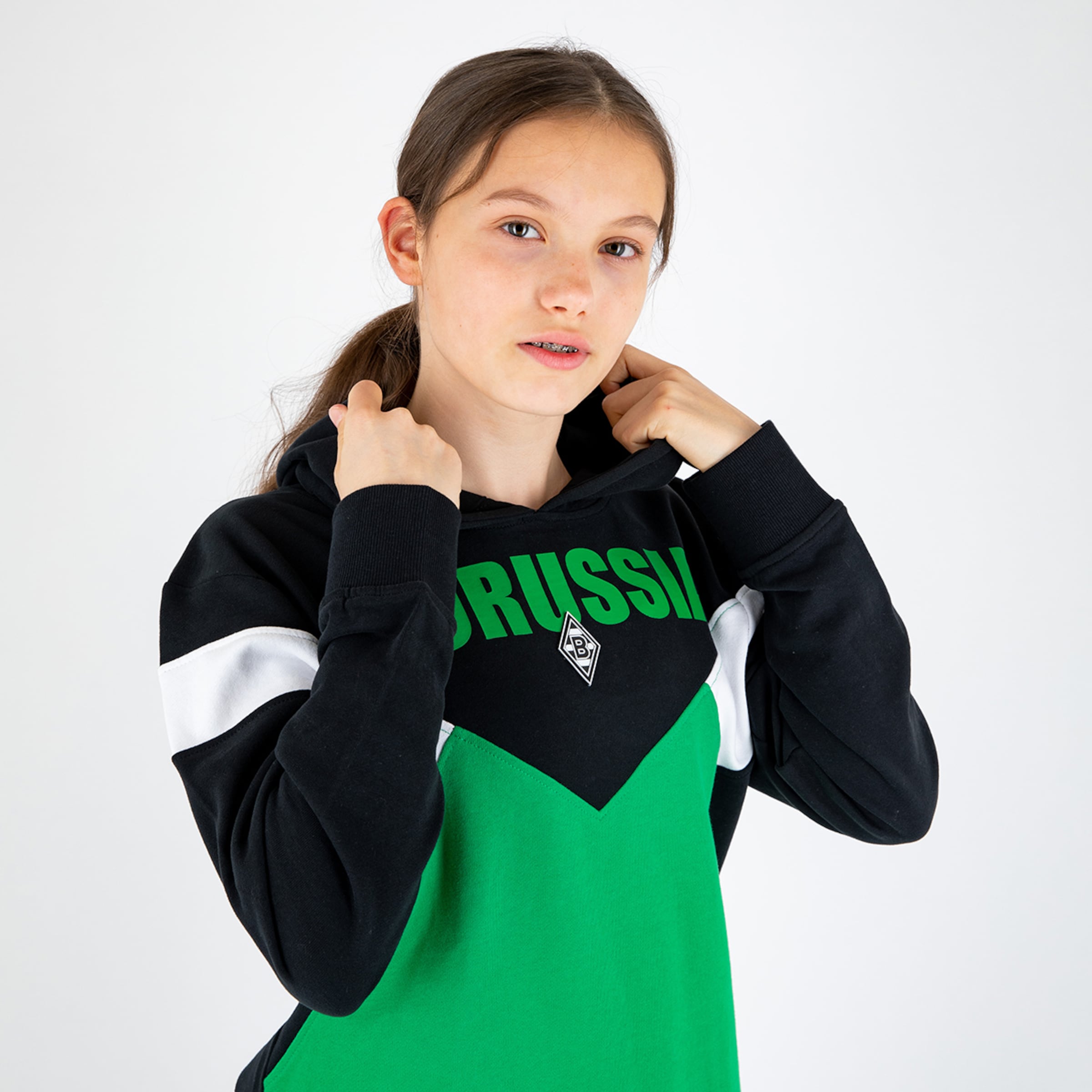 Girl wearing a hoodie with the text Borussia.