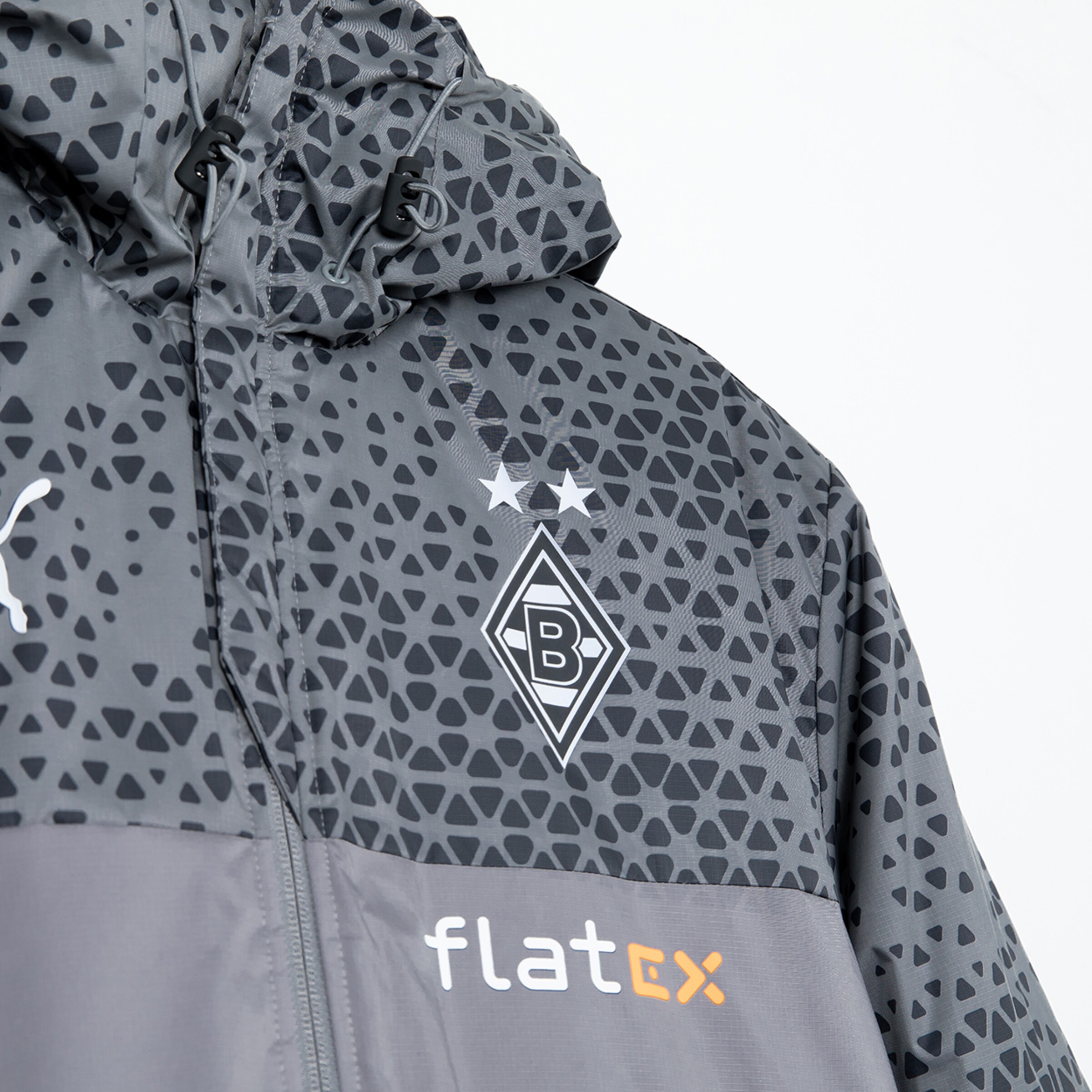 Graue Sportjacke mit Borussia Mönchengladbach Logo und Sponsorenlogo.