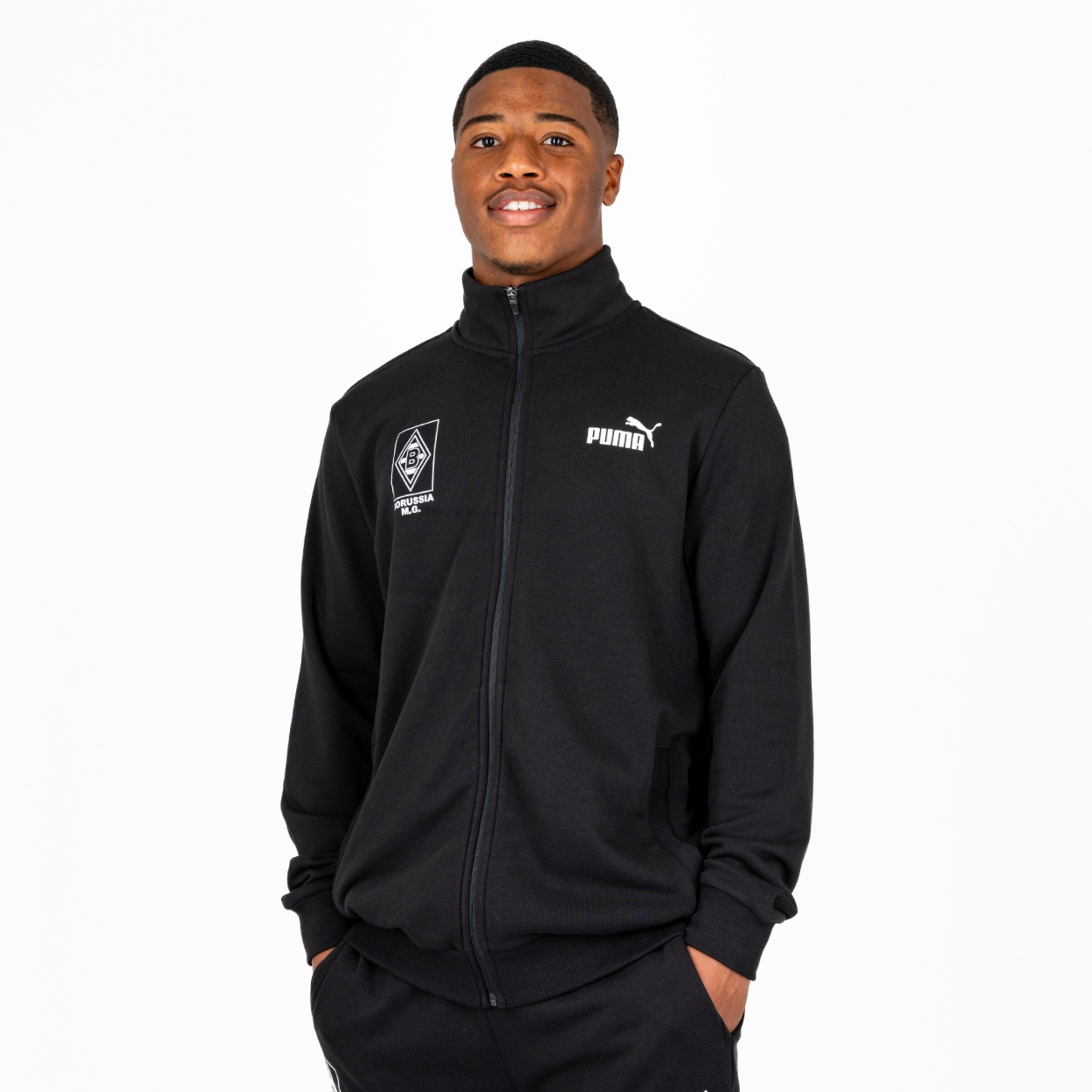 Athletic person in black jacket with logo