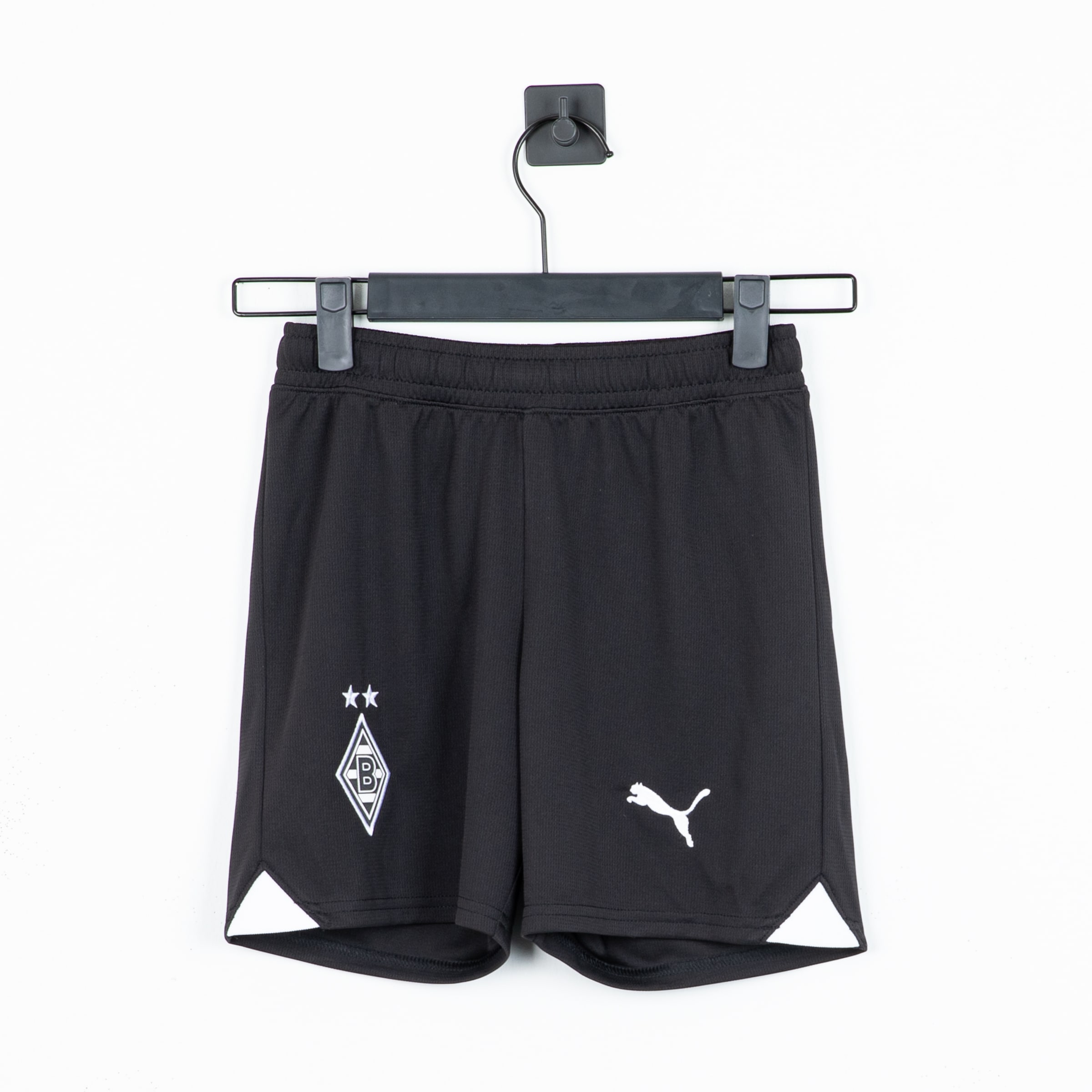 Black Puma football shorts for Borussia Mönchengladbach with white team crest and triangular side inserts.