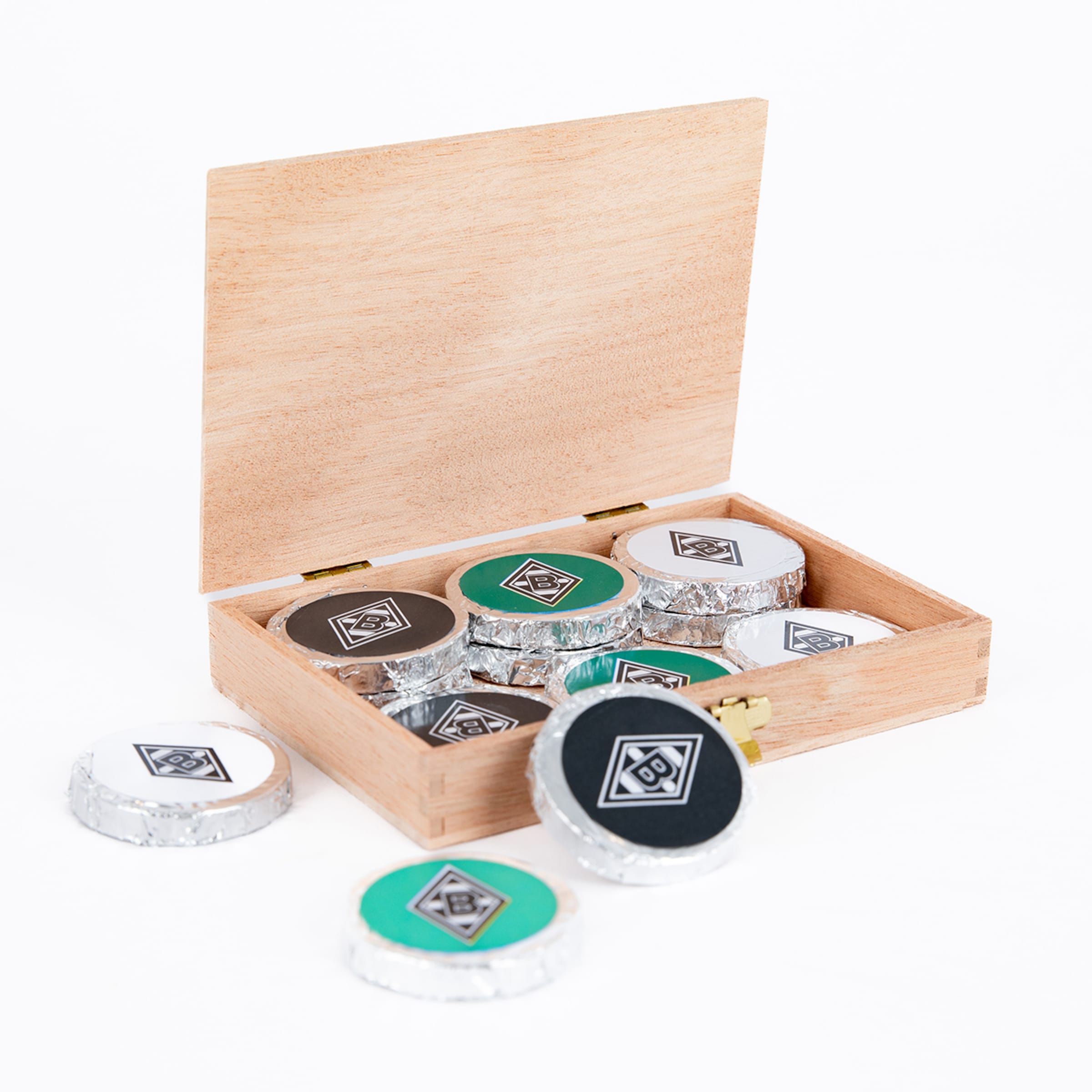 Set of game chips in a wooden box some visible various colors featuring Borussia Mönchengladbach logo.