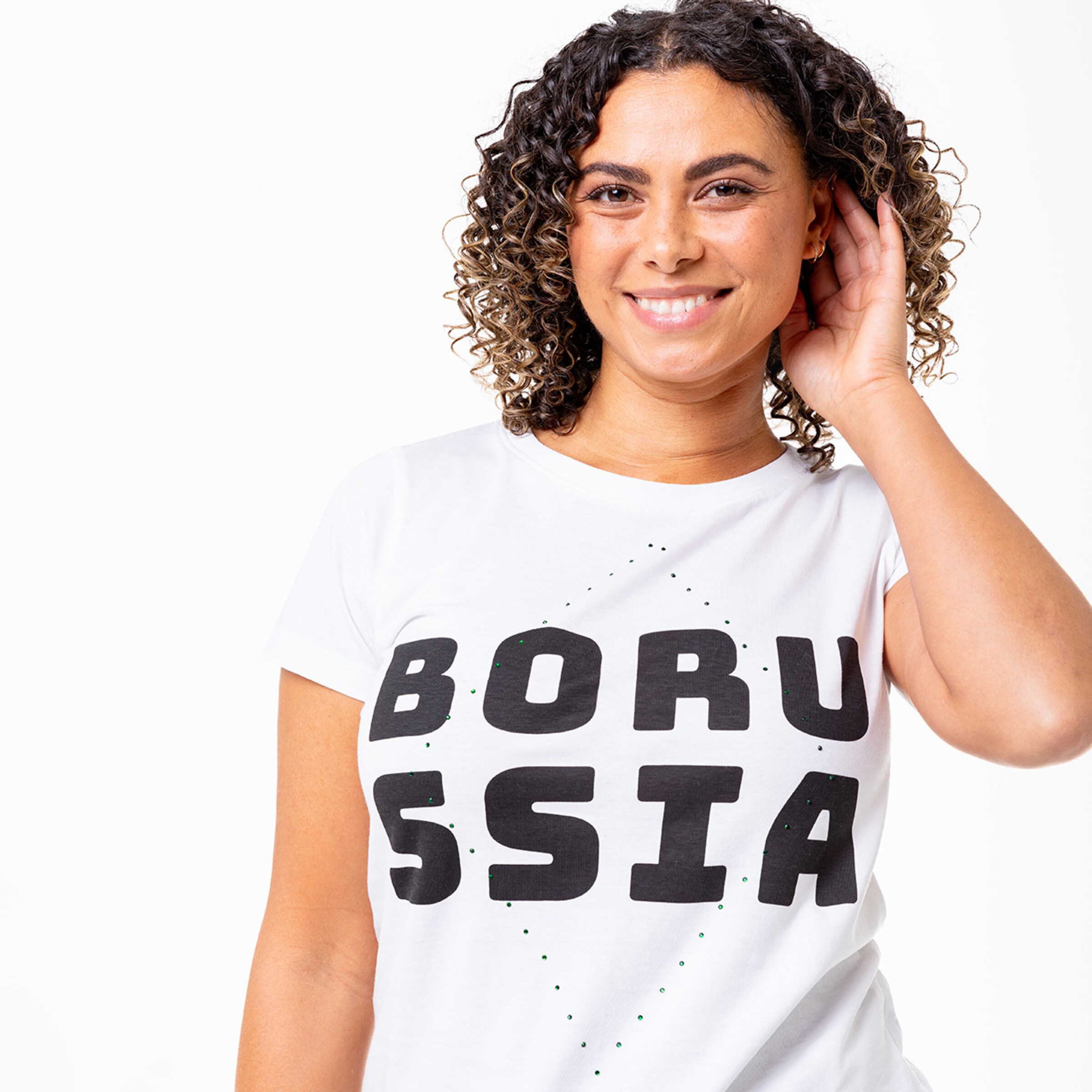 A person wearing a white T-shirt with the text BORUSSIA.