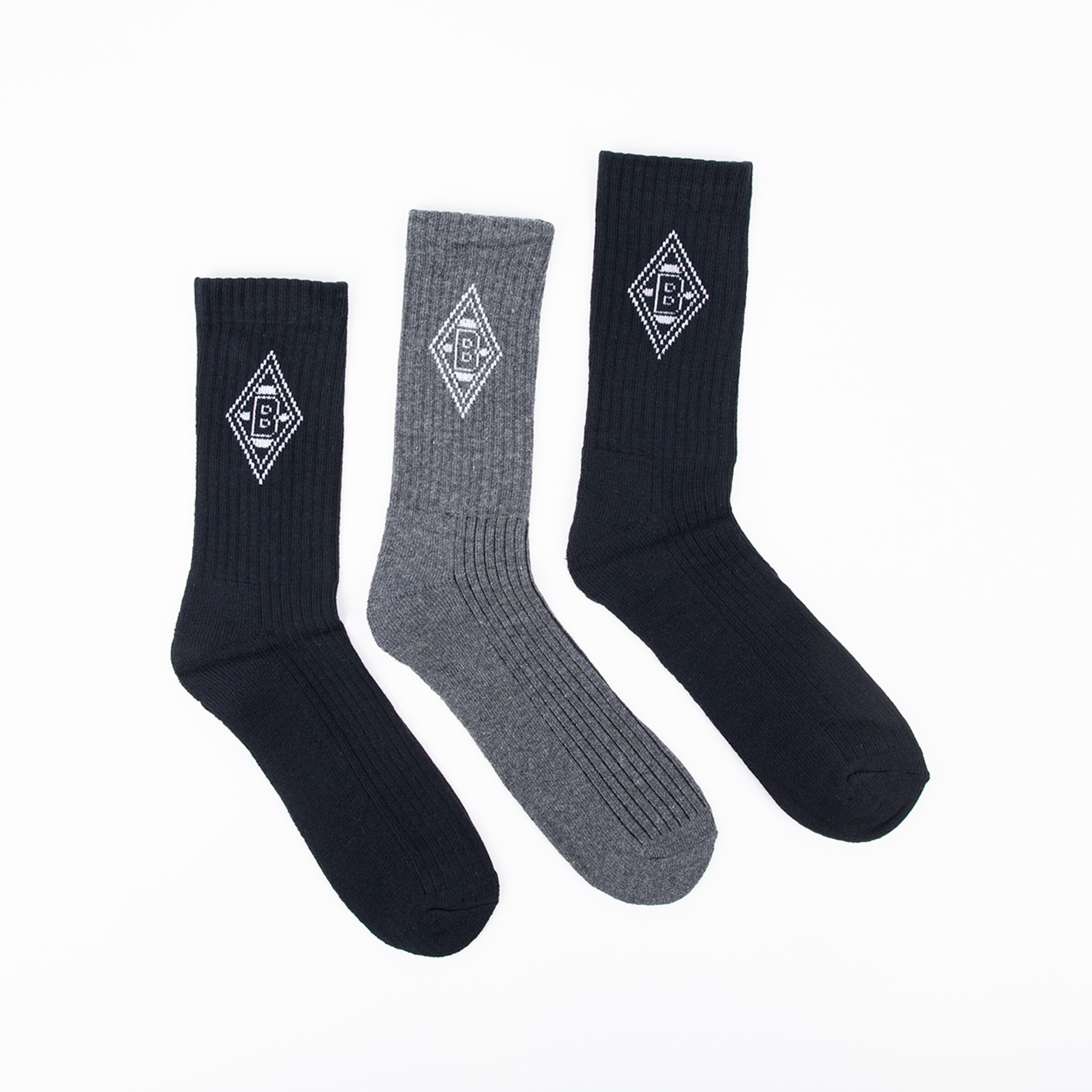 Three pairs of socks in varying shades of gray and black featuring the Borussia Mönchengladbach logo.