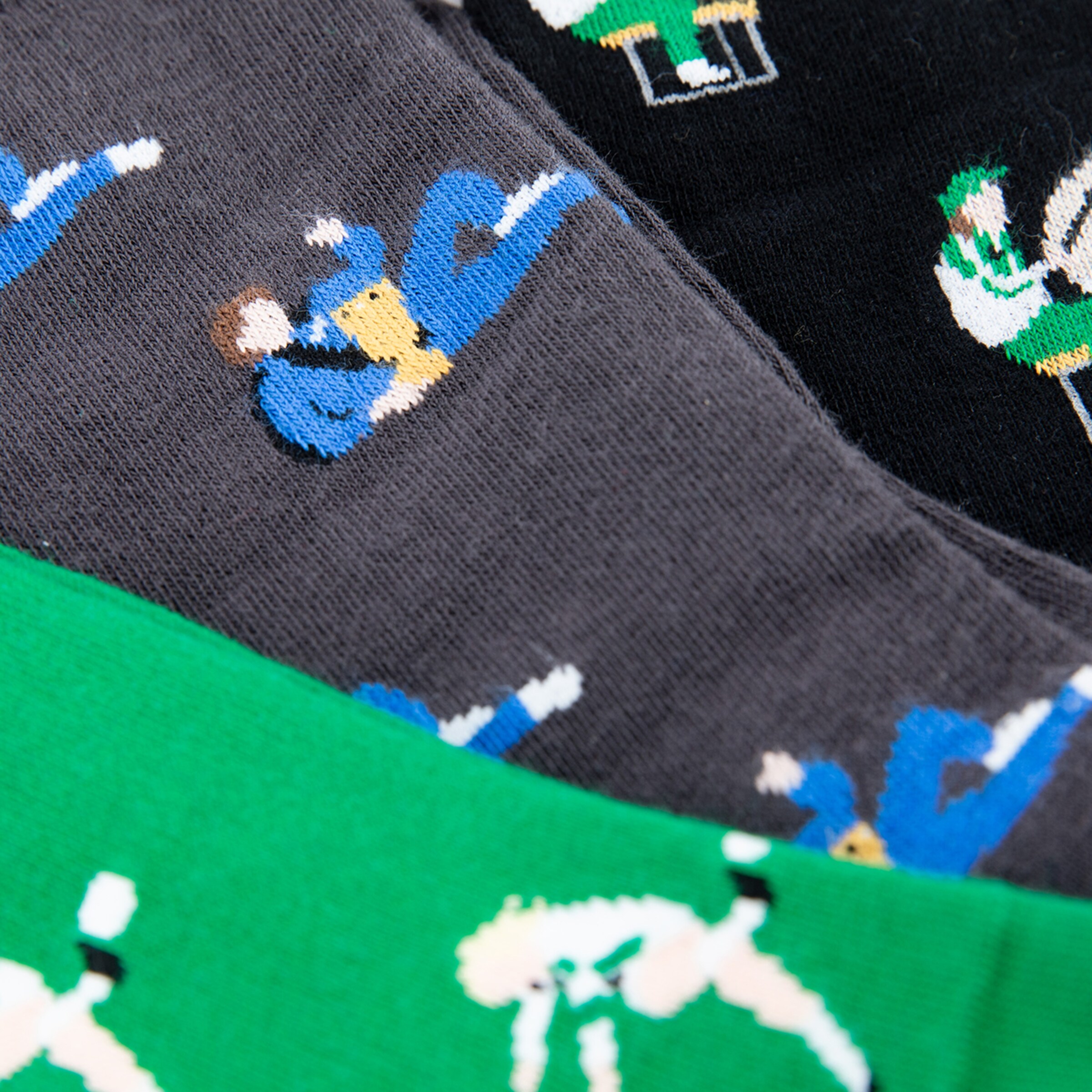 Socks featuring different designs of soccer players in action