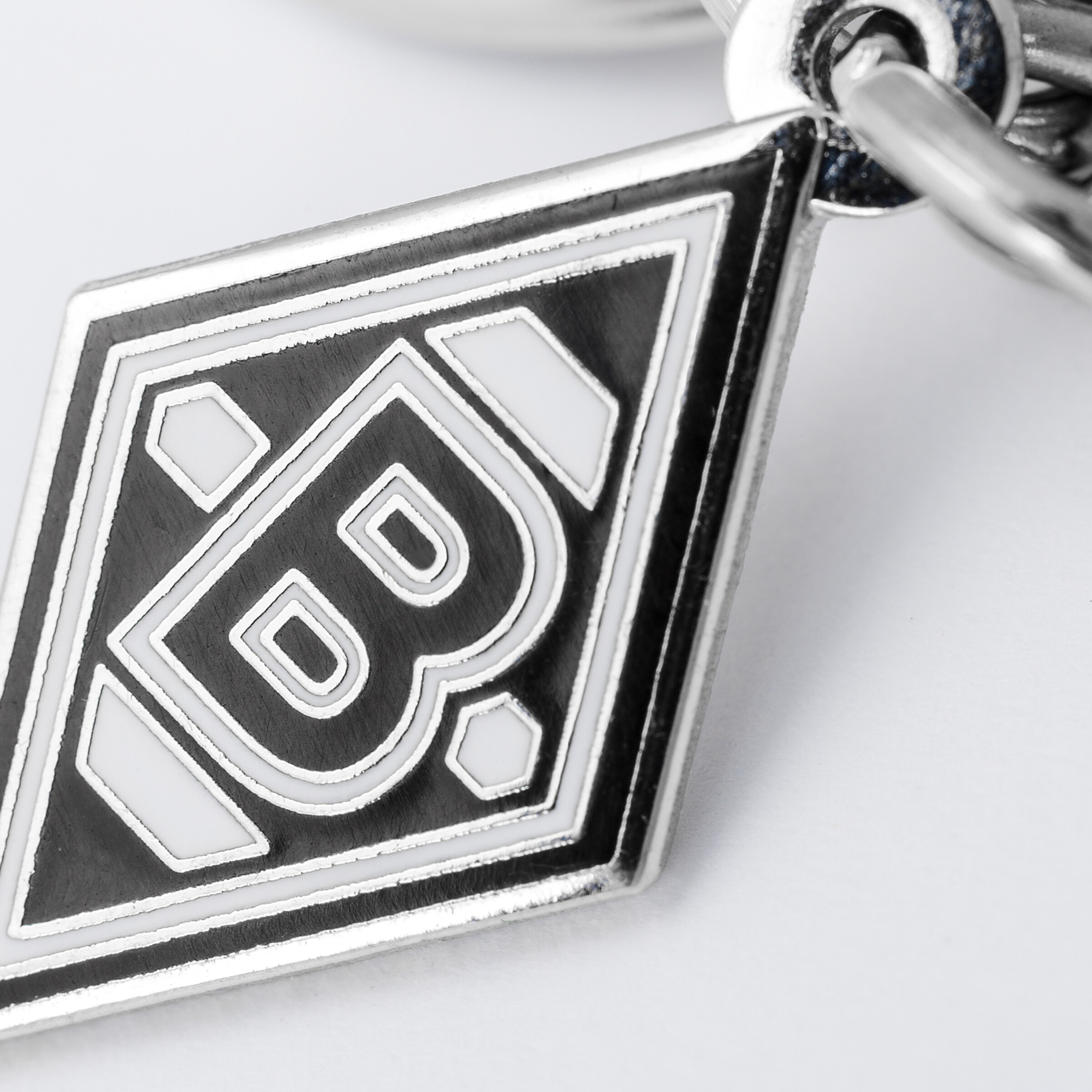 Keychain featuring Borussia Mönchengladbach logo in black and white.